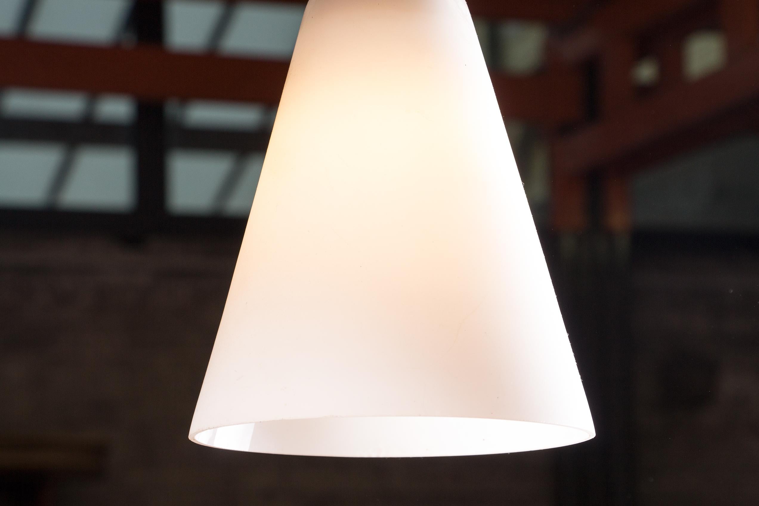 Scandinavian conical pendant light in teak and Opaline by Louis Kalff. 3