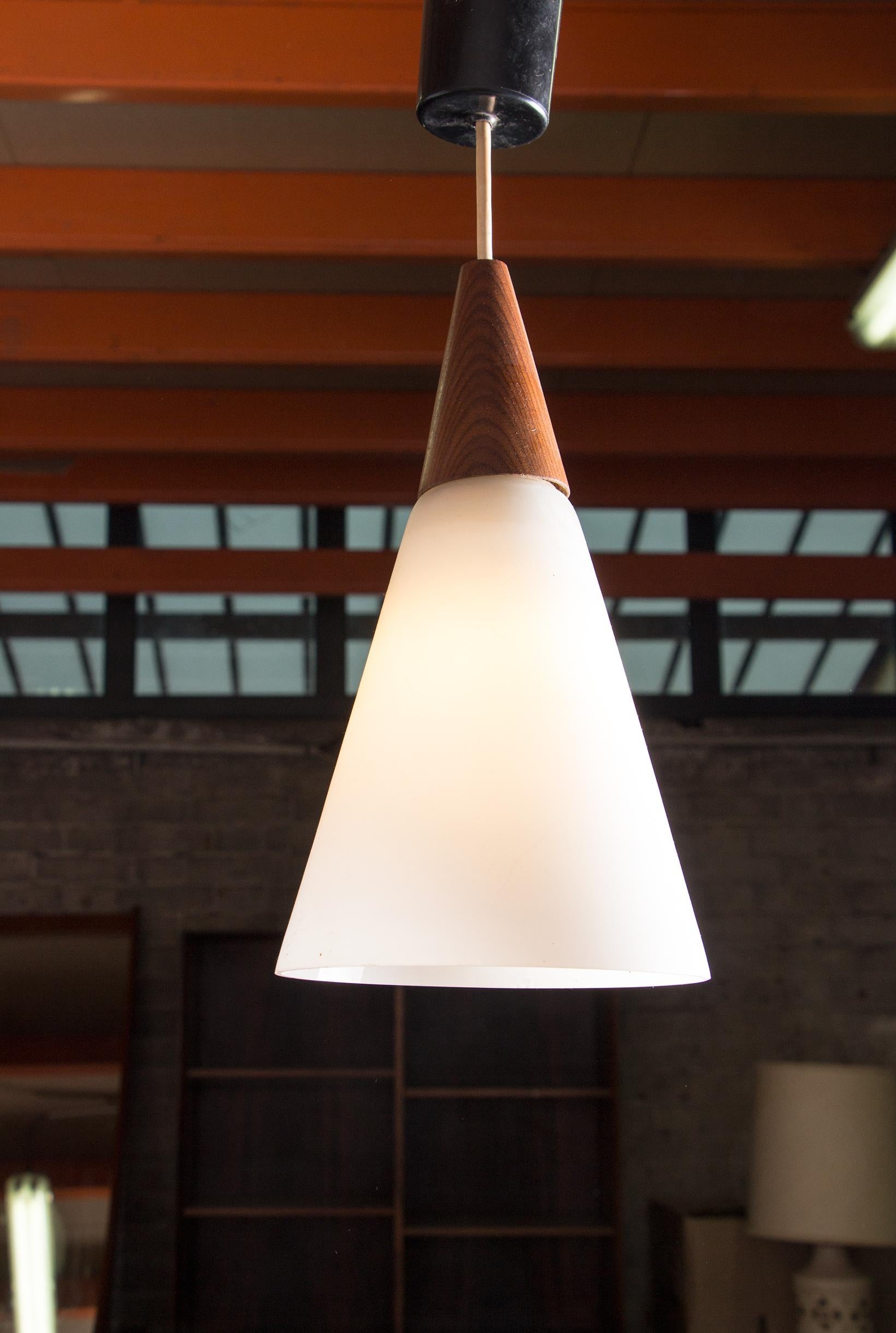 Scandinavian conical pendant light in teak and Opaline by Louis Kalff. 4