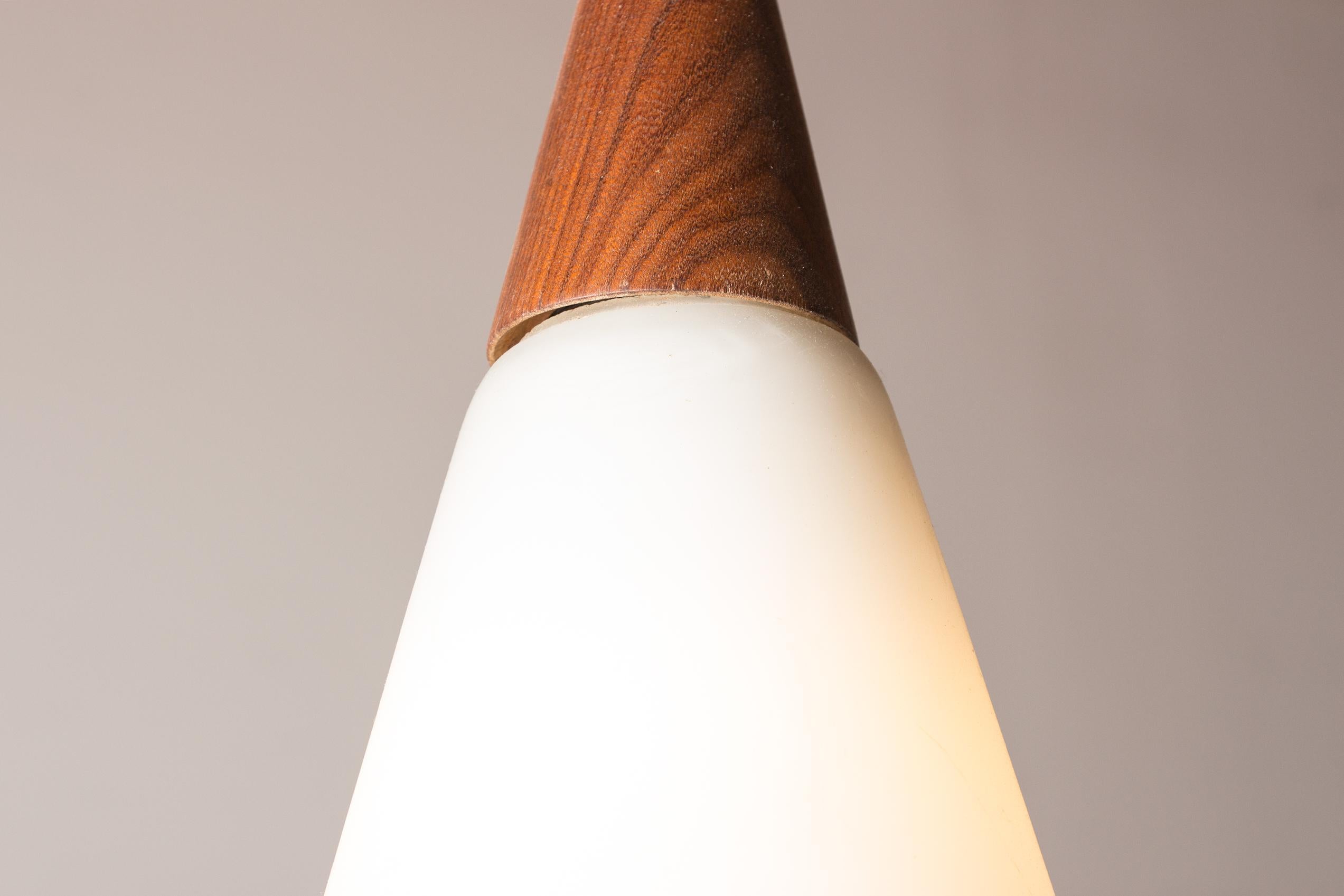 Scandinavian conical pendant light in teak and Opaline by Louis Kalff. 5