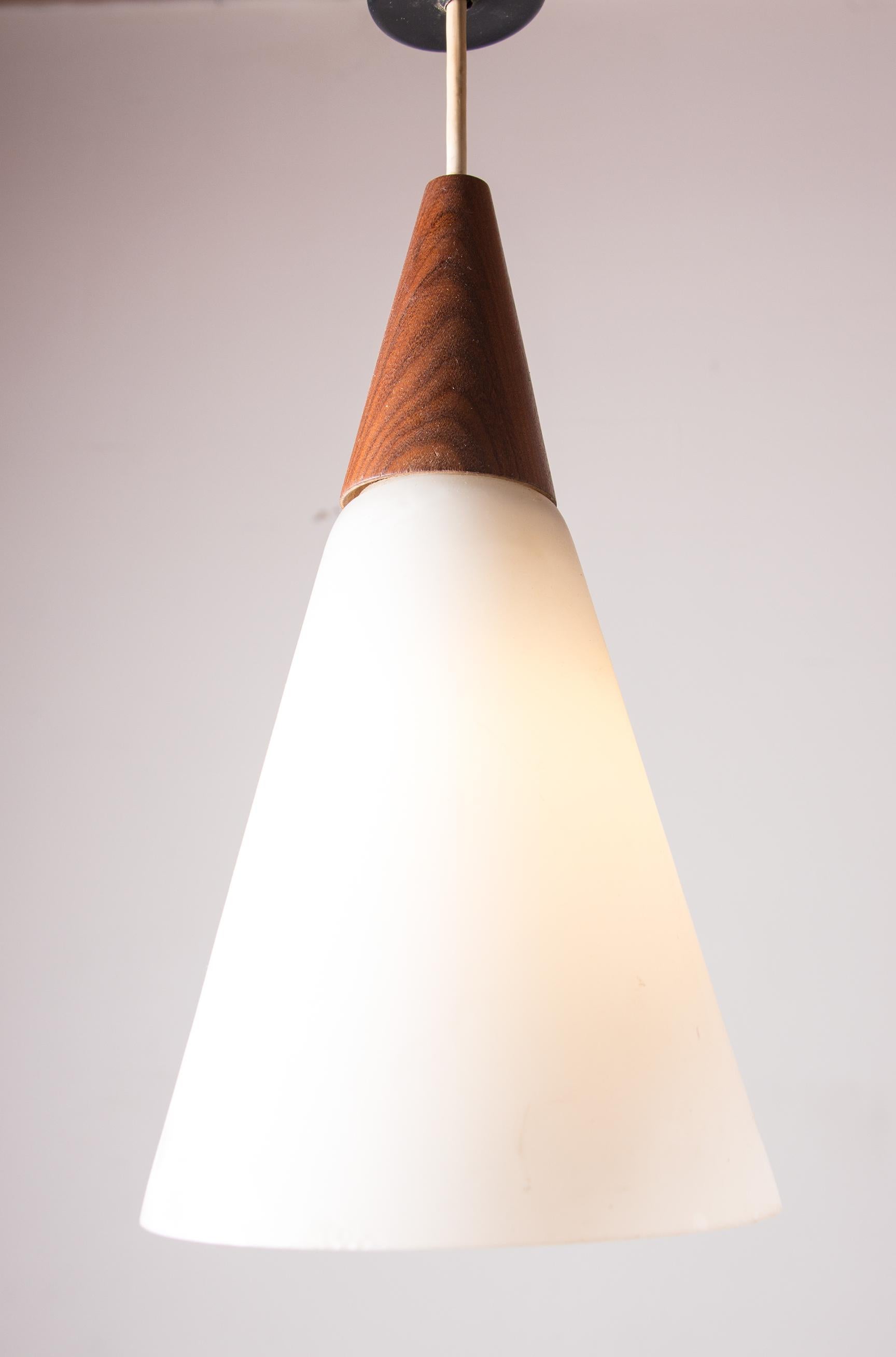 Scandinavian conical pendant light in teak and Opaline by Louis Kalff. 6