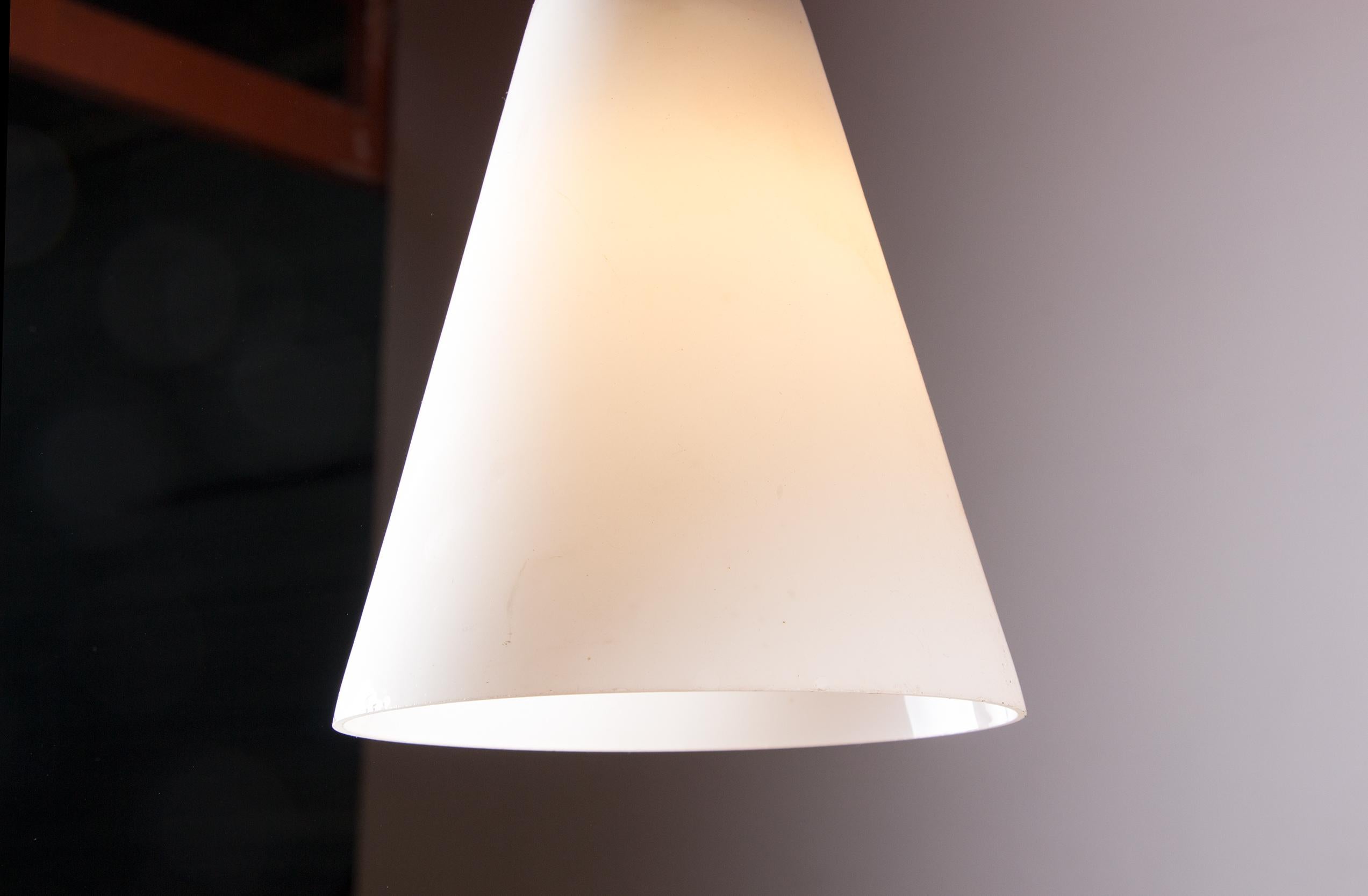 Opaline Glass Scandinavian conical pendant light in teak and Opaline by Louis Kalff.