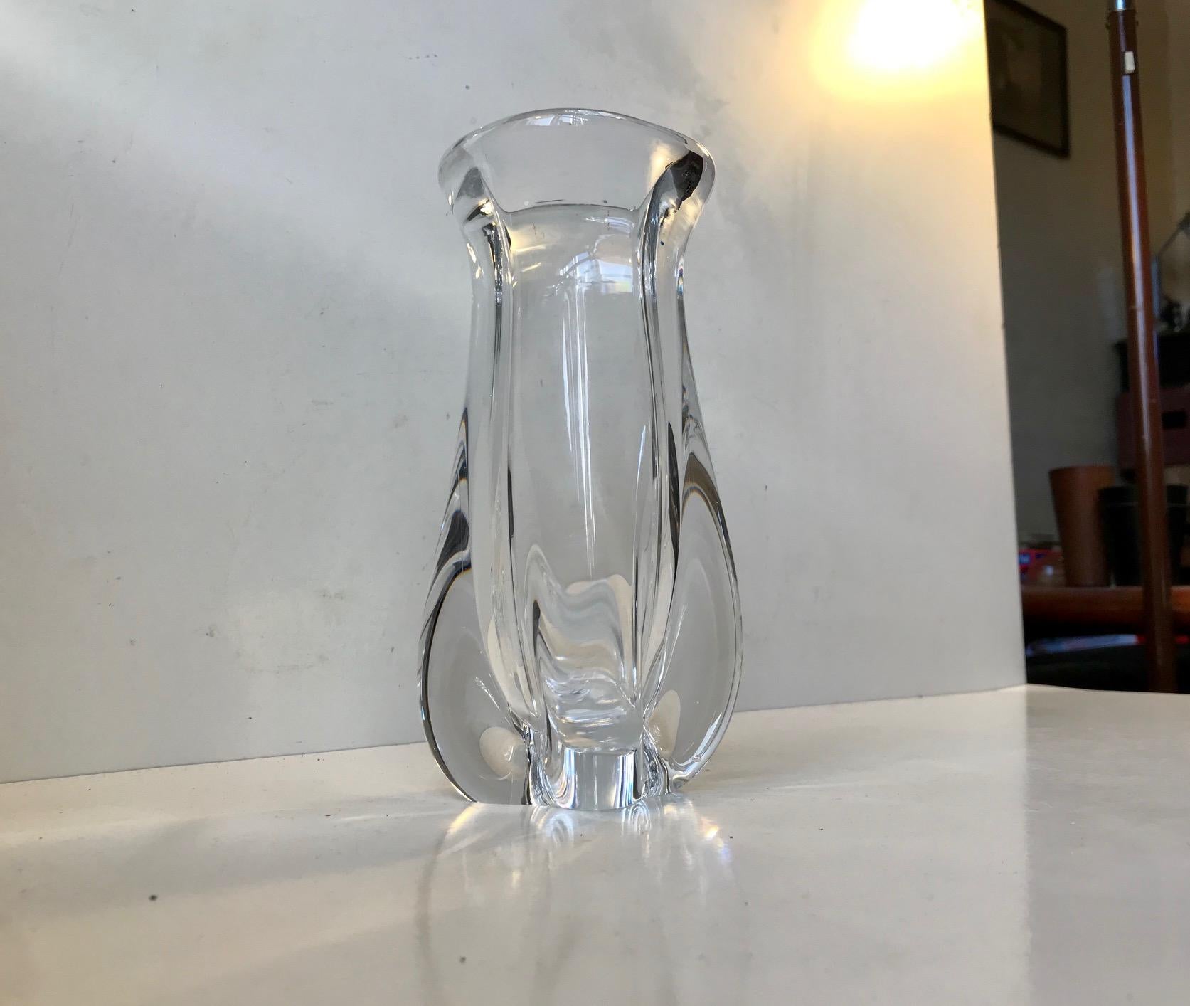 Thick organically shaped crystal vase. Designed by Niels Landberg and manufactured at Orrefors in Sweden during the 1950s. Fine, intact and clean vintage order.