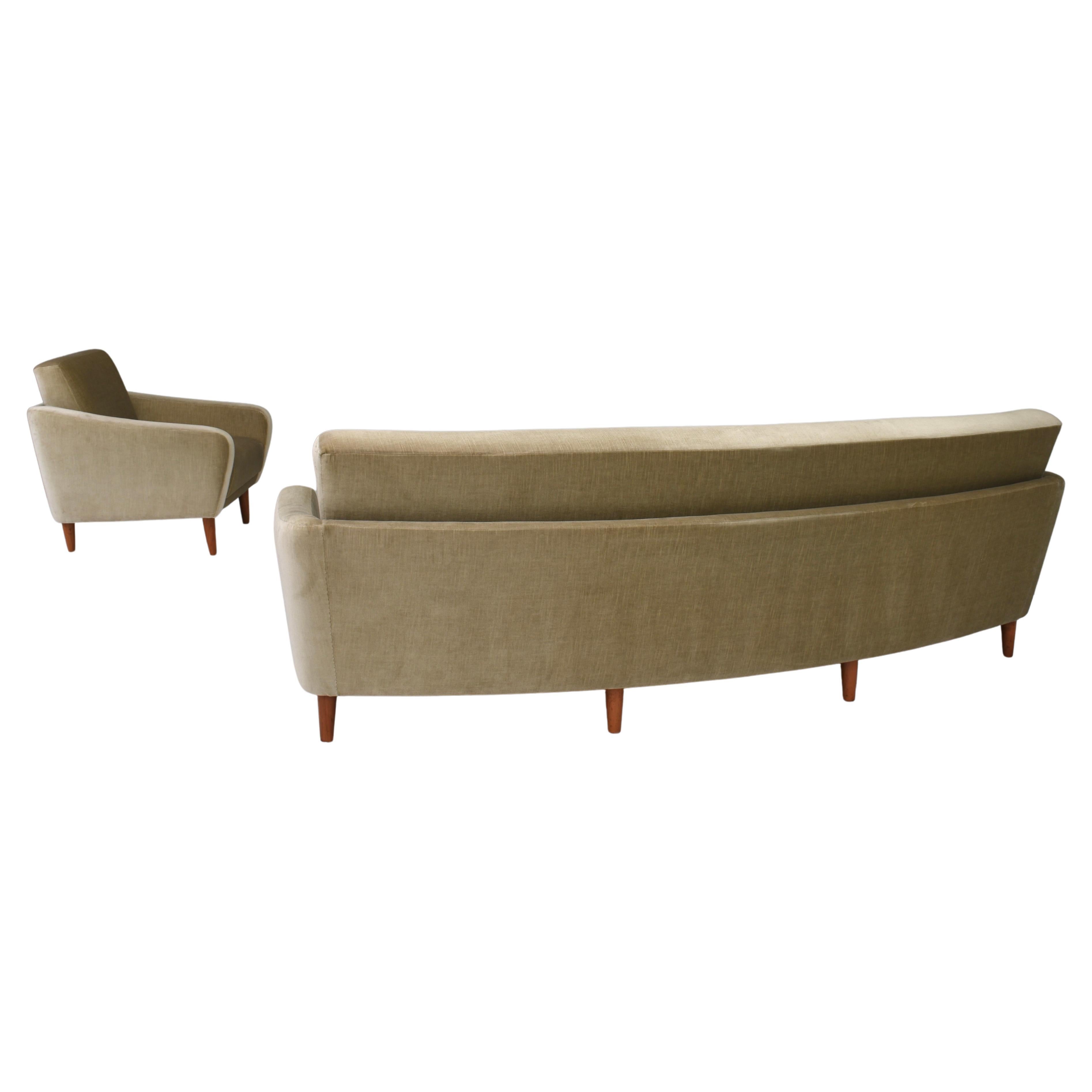 Curved Danish sofa and arm lounge chair in original Mohair velvet fabric and teak legs, circa 1950.
The Mohair fabric is still original and in very good condition with minor signs of age and use. All the upholstery is made of the same olive green