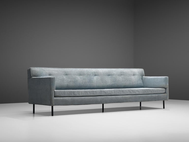 Edward Wormley for Dunbar, sofa 5150, grey fabric, metal, United States, 1950s. 

The style of the sofa is simple and elegant as it bears features of classic design as where Edward Wormley is known for. He designed this comfortable four-seat sofa