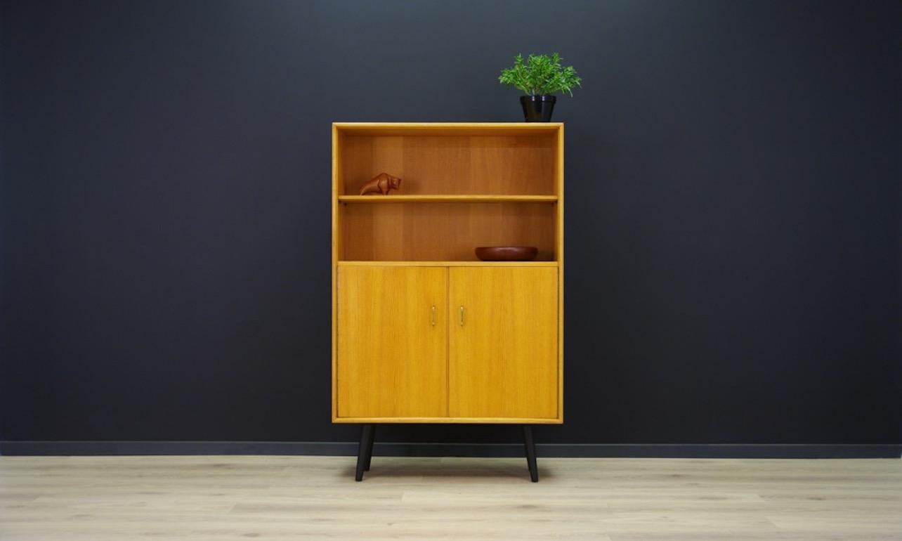Original cabinet or bookcase from the 1967s, Minimalist form, Danish design. Form veneered with ash. Capacious space with a shelf behind the door and a bookshelf. Preserved in good condition (minor scratches) directly for use.
 

Dimensions:
