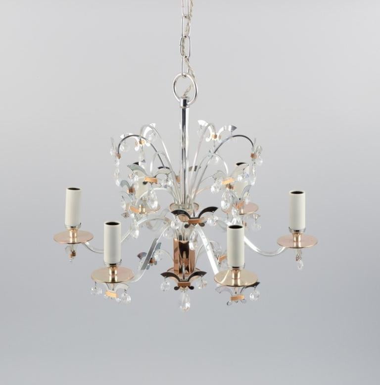 Scandinavian design, metal chandelier with crystals.
Approx. 1980.
In excellent condition.
Dimensions: D: 40.0 x H 38.0 (without chain) total approx. 80.0 cm.