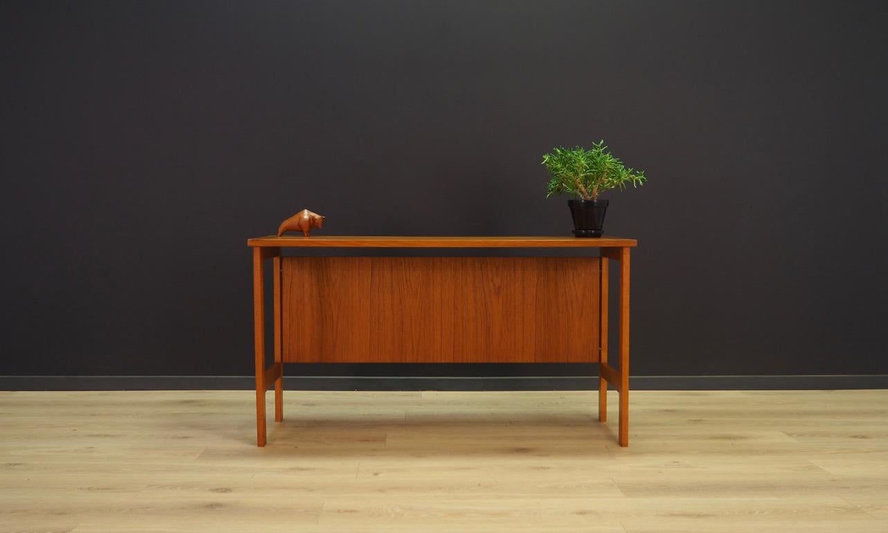 Original writing desk from the 1960s-1970s, Minimalist Danish design. The whole veneered with teak. Preserved in good condition (small bruises and scratches), directly for use.

Dimensions: Height 68 cm top 125 cm x 45 cm.
