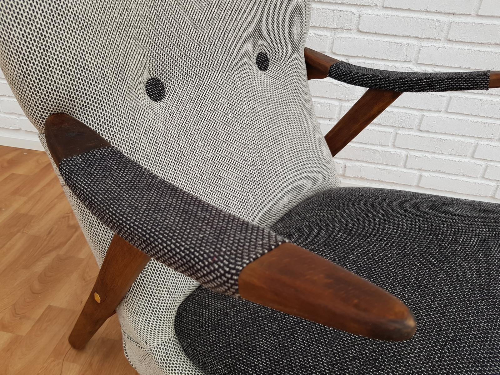 Armchair, Scandinavian design. Produced in 1960-1970. Legs and armrests of stained beech wood. Completely restored by craftsman, furniture upholsterer at Retro Møbler Galleri. Brand new padding with coconut mat. New reupholstered in quality wool