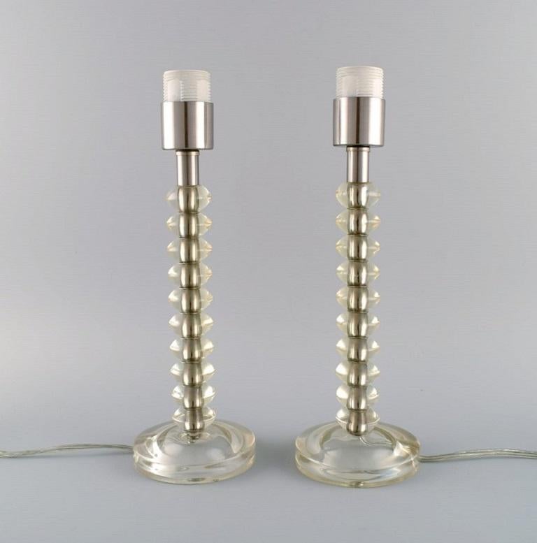 Scandinavian designer. A pair of vintage table lamps in plexiglass and chromed metal. 1970s.
Measures: 34 x 11 cm.
In excellent condition.