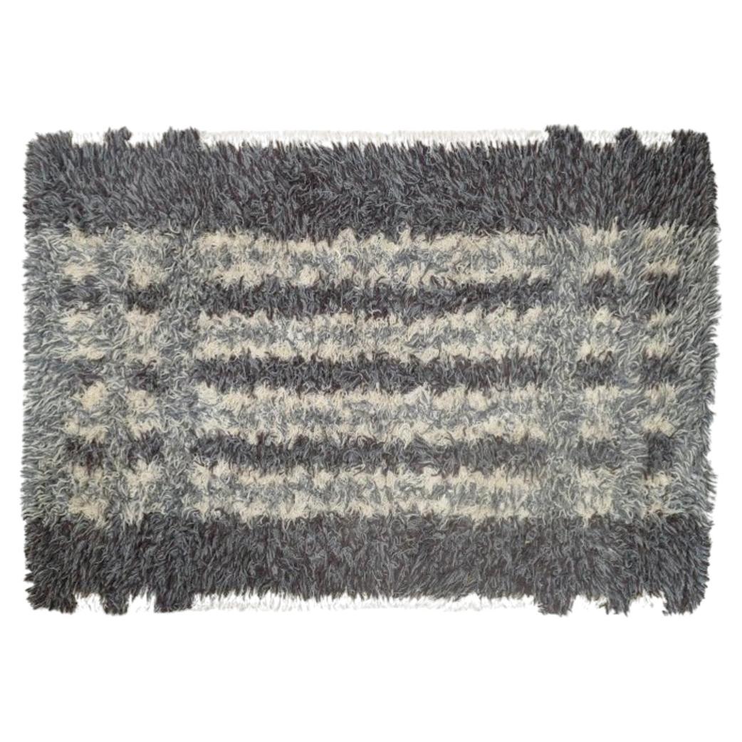 Scandinavian designer. Rya carpet, geometric pattern in shades of grey and cream