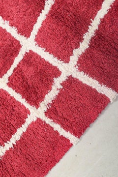 Scandinavian designer. Rya carpet in cotton in red and white tones.