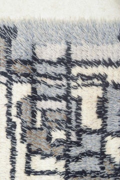 Scandinavian designer. Rya carpet in wool in black, grey, and cream tones.