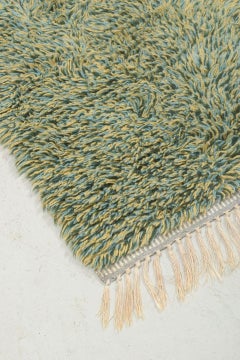 Scandinavian designer. Rya carpet with a dense pile in shades of green and beige