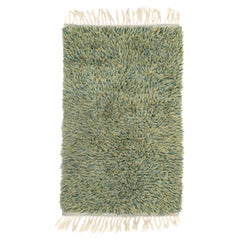 Scandinavian designer. Rya carpet with a dense pile in shades of green and beige