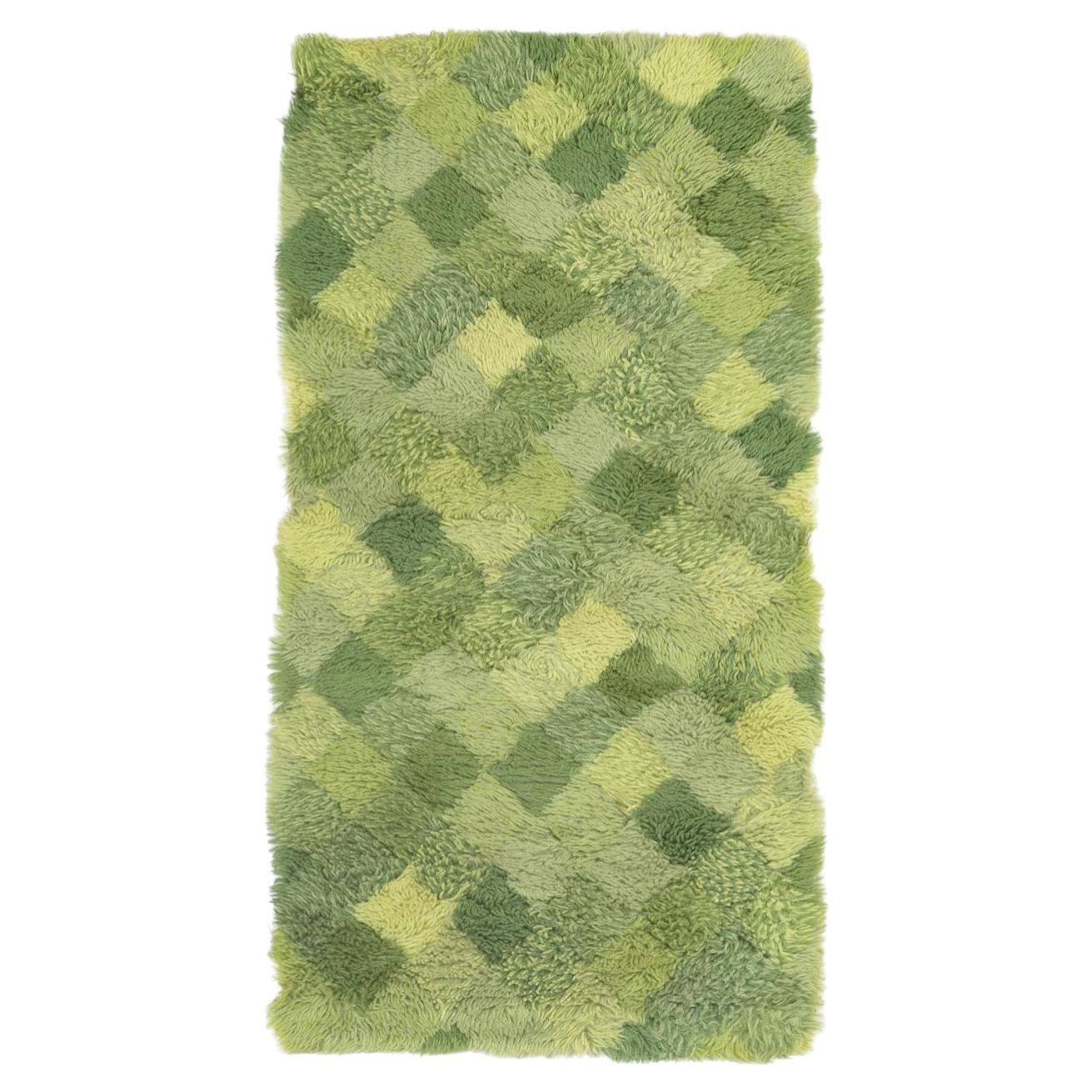 Scandinavian designer. Rya carpet with checkered pattern in shades of green. For Sale