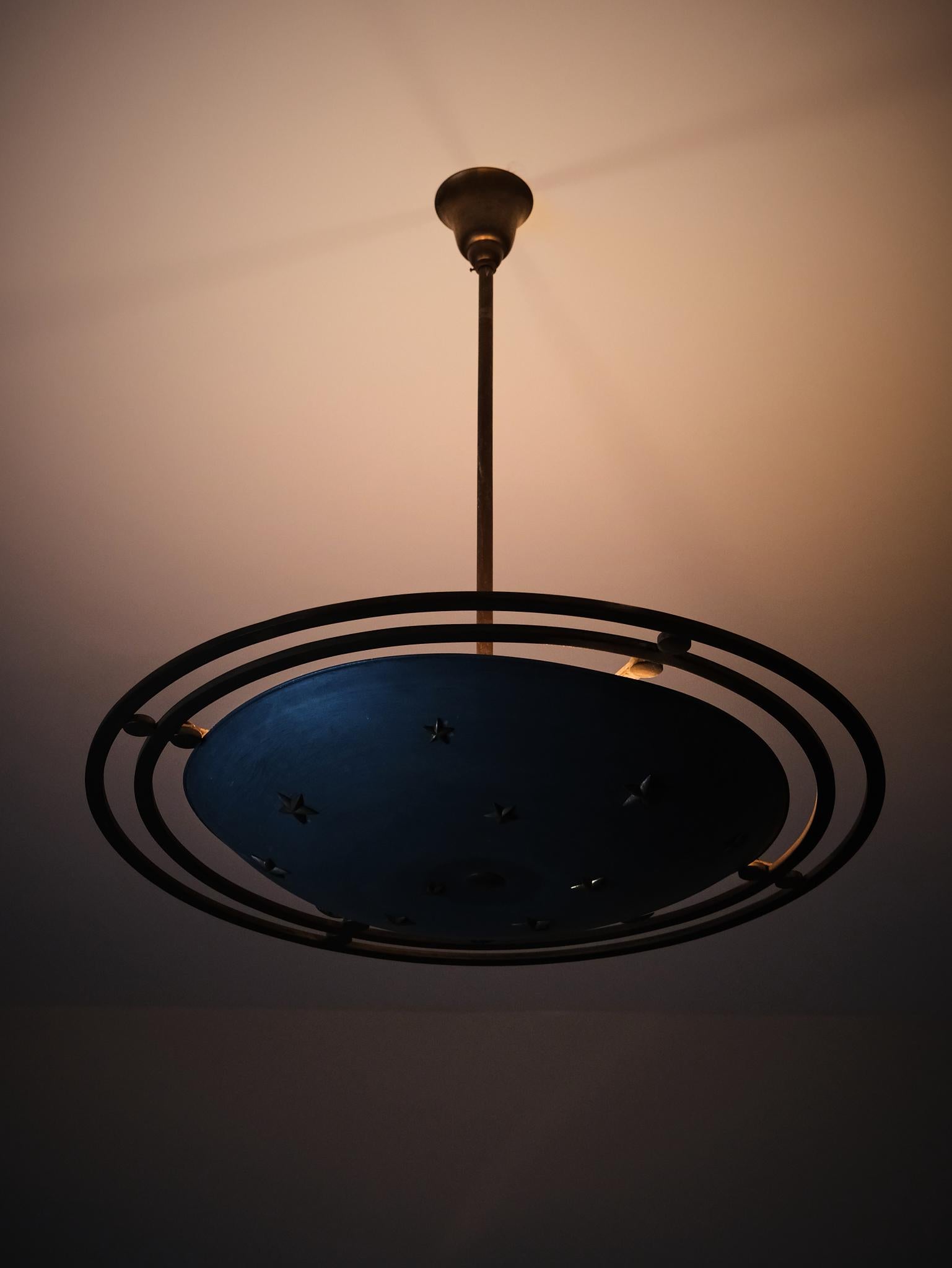 This elegant ceiling lamp, crafted from zinc and bronze, showcases a refined Scandinavian design aesthetic from the 1930s–1940s. Though the designer remains unknown, the piece reflects the era’s distinct blend of functionality and decorative