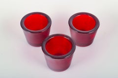 Scandinavian designer. Three tealight holders in red glass. Late 20th C.