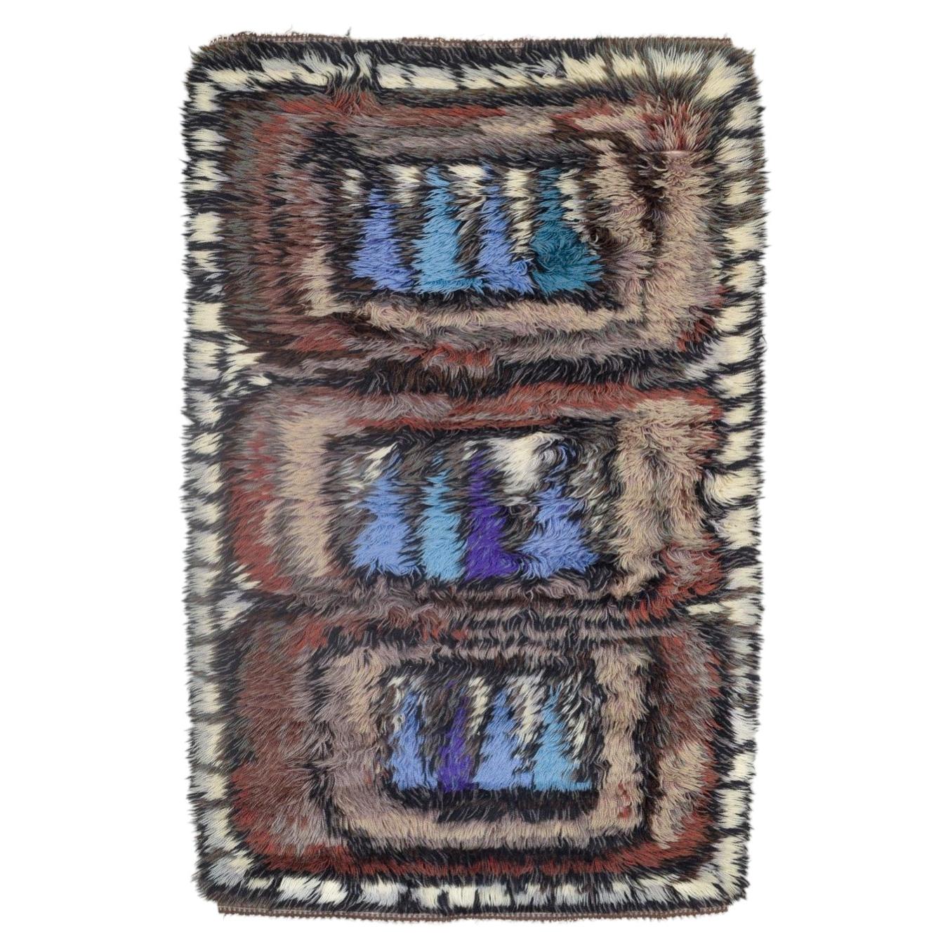 Scandinavian designer. Wool Rya carpet in shades of blue, purple, brown, beige. For Sale