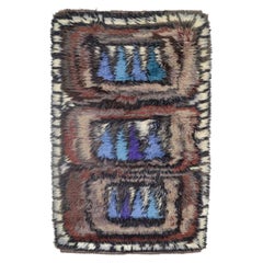 Scandinavian designer. Wool Rya carpet in shades of blue, purple, brown, beige.