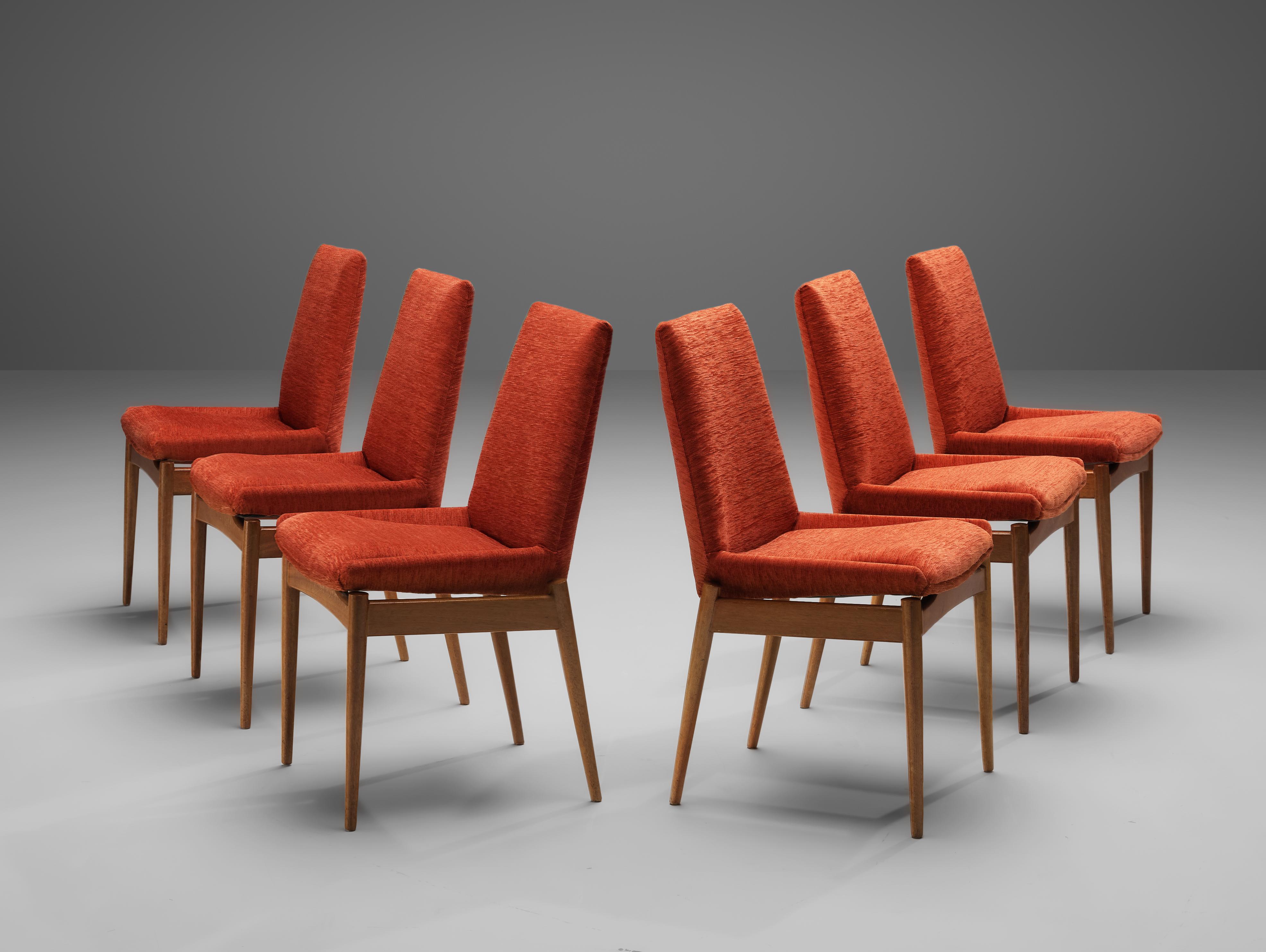 Set of 6 dining chairs, teak, red orange corduroy, Scandinavia, 1950s

The set of six chairs is sculptural and elegant. The design features a high, sculpted back. The curved, tapered legs are another main feature of the chairs. The main feature of