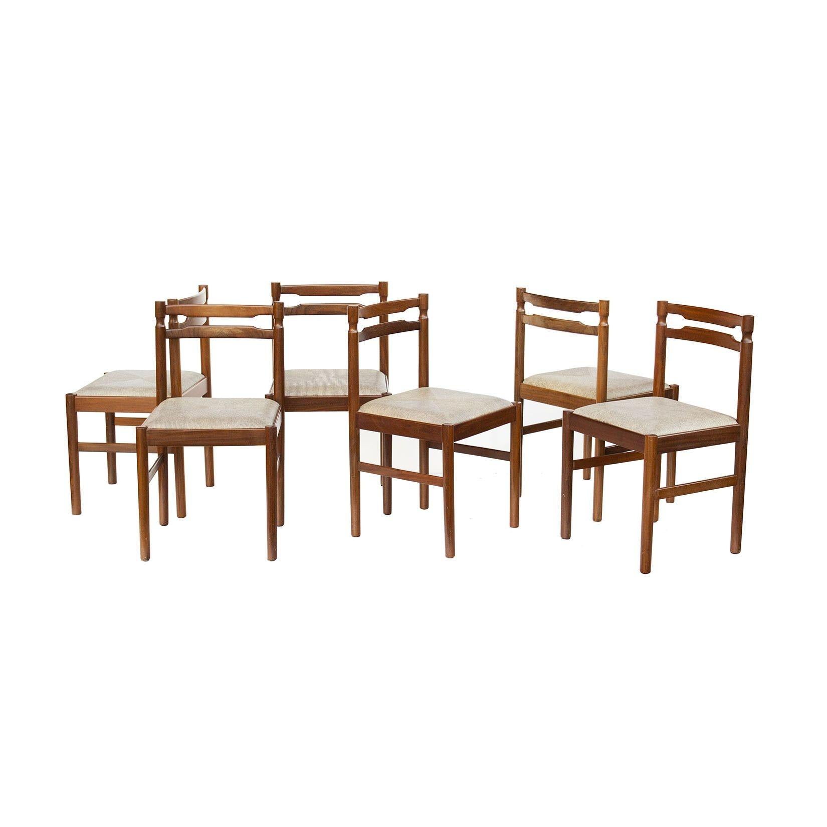 Scandinavia, 1960s
Set of six Scandinavian dining chairs in teak or rosewood. These are a nicely turned set in rich wood tones. Upholstery is in a textured neutral warm grey vinyl and it is in very good condition- usable as is with soft cushions. No