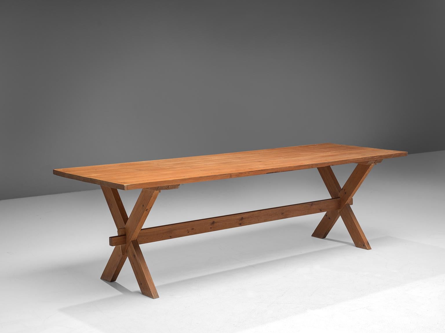 Dining table, solid pine, Scandinavia, 1960s.

This large dining table is made of solid pine in the 1960s. The table features x-legs which gives the table an architectural appearance, which are slender. The table is robust, yet well-balanced. The