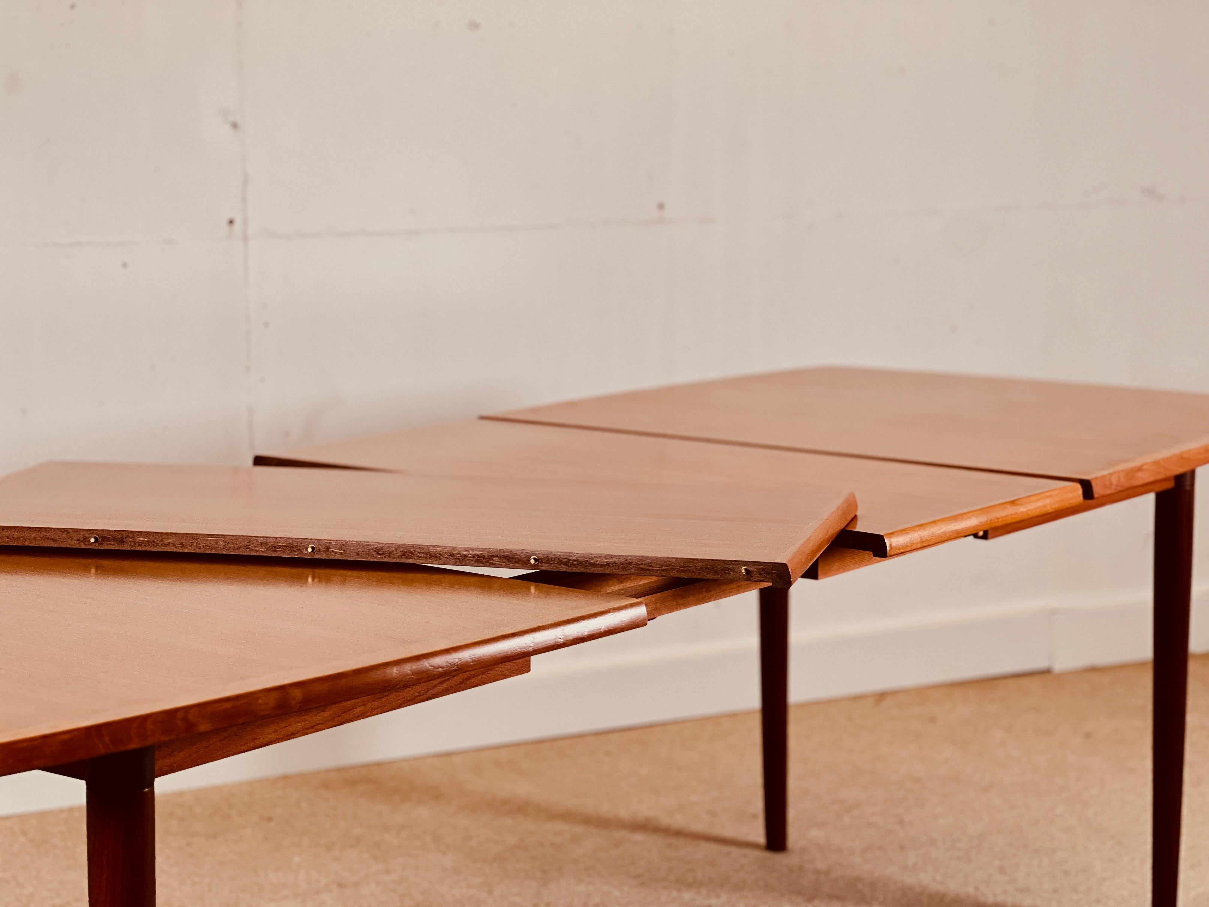 20th Century Scandinavian dining table with double extension.