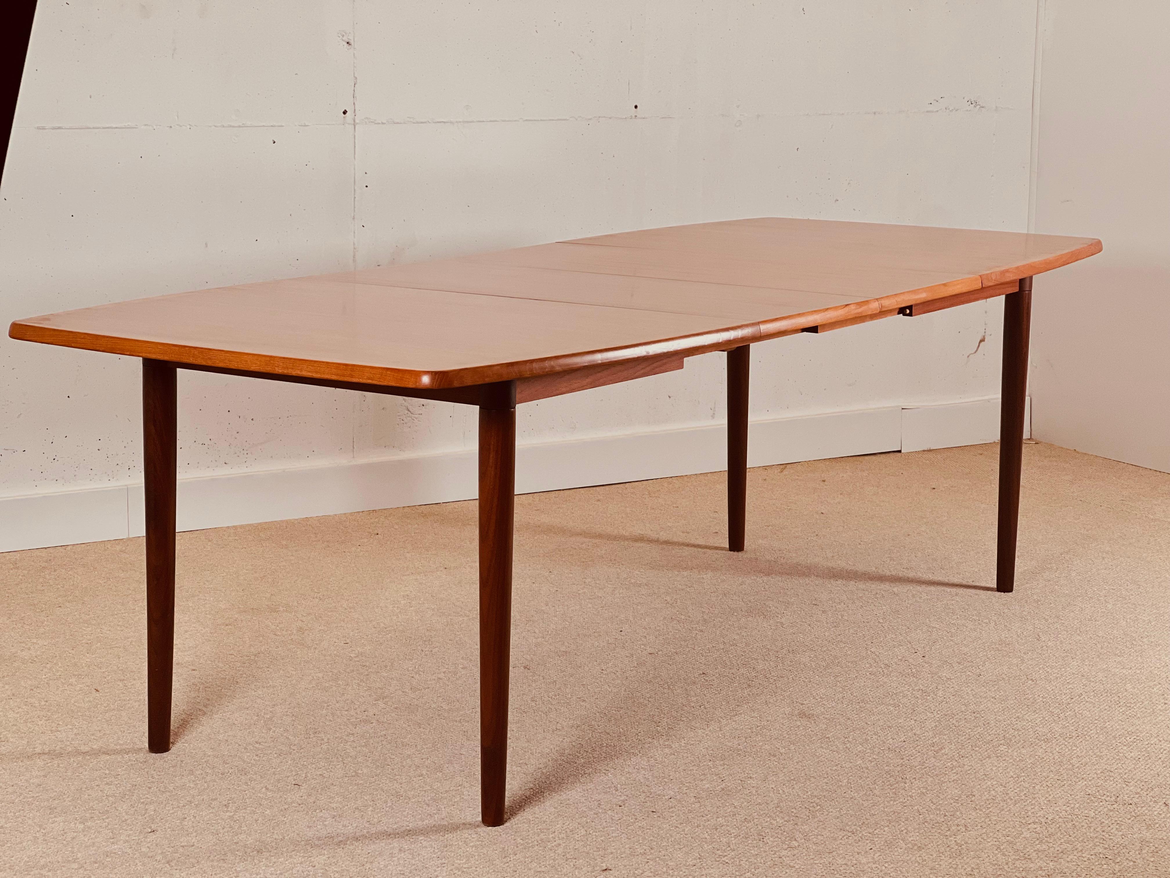 Teak Scandinavian dining table with double extension.