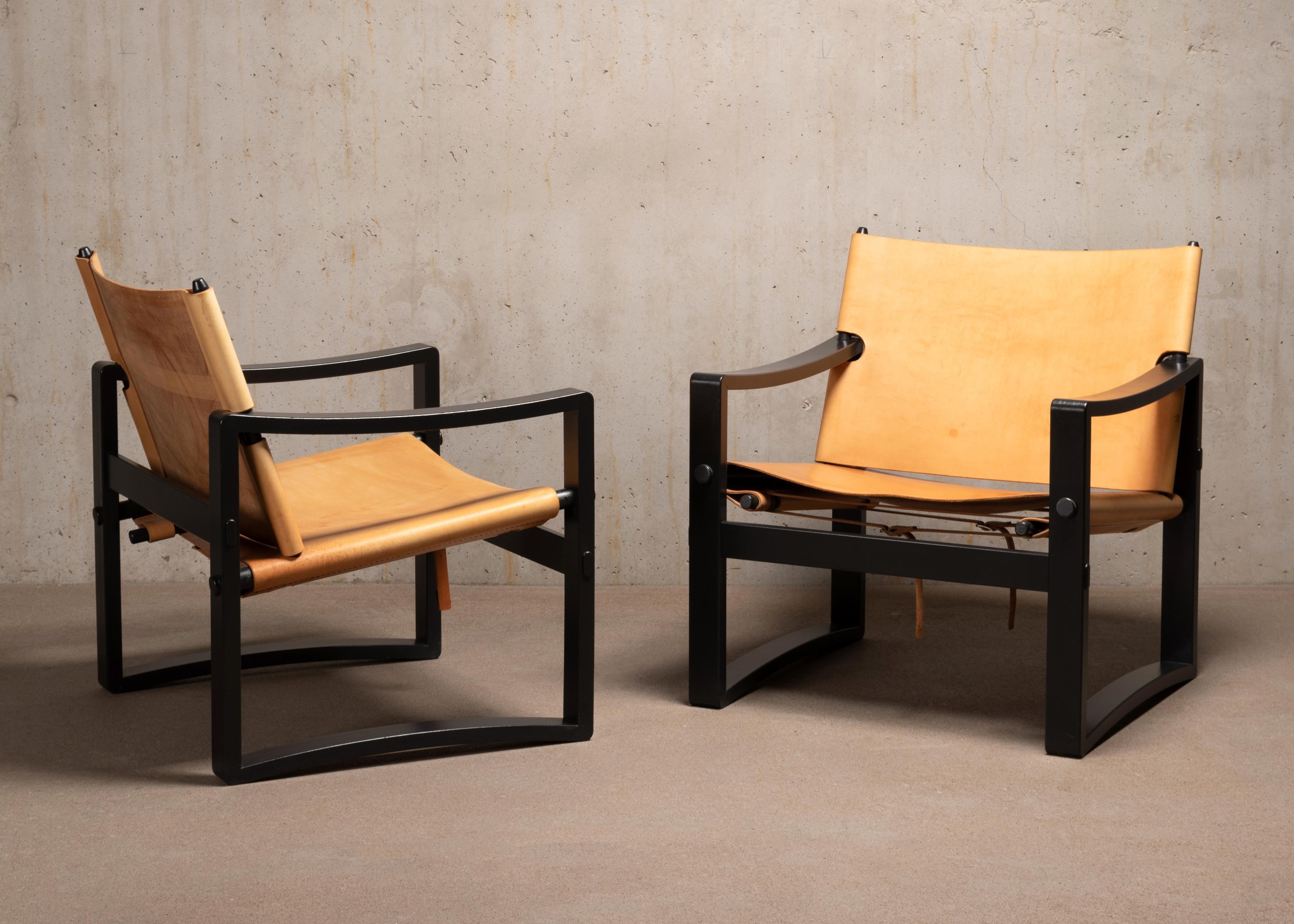 20th Century Scandinavian Easy Armchairs in Graphite Black Wooden Frames and Cognac Leather