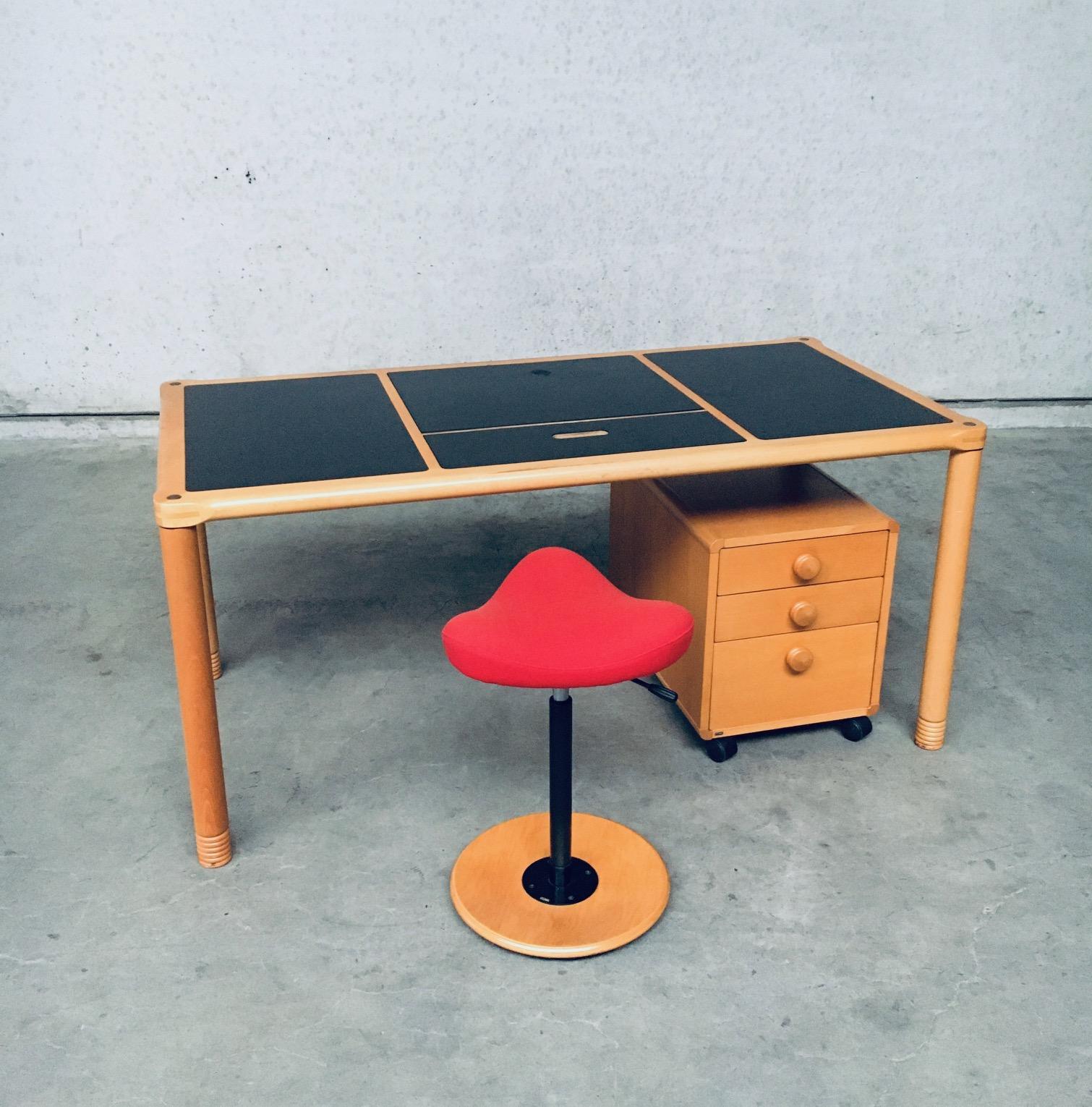 Vintage Scandinavian ergonomic design writing desk with pivoting stool, made by Stokke, Norway 1980's. Ergonomical designed writing desk with black inlay and middle reading section wich can be altered in angle for easy reading. This middel piece can