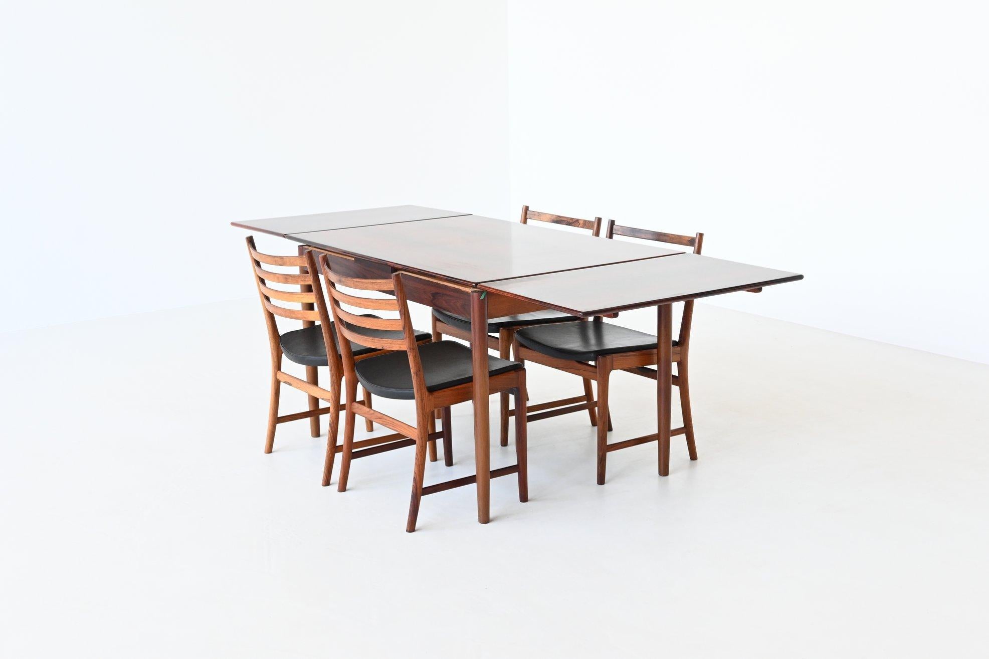 Beautiful rosewood extendable dining table by unknown designer or manufacturer, Denmark 1960. This well-crafted table is made of rosewood and has an amazing grain to the warm rosewood veneer. It can be extended from 123 cm to 223 cm by pulling out
