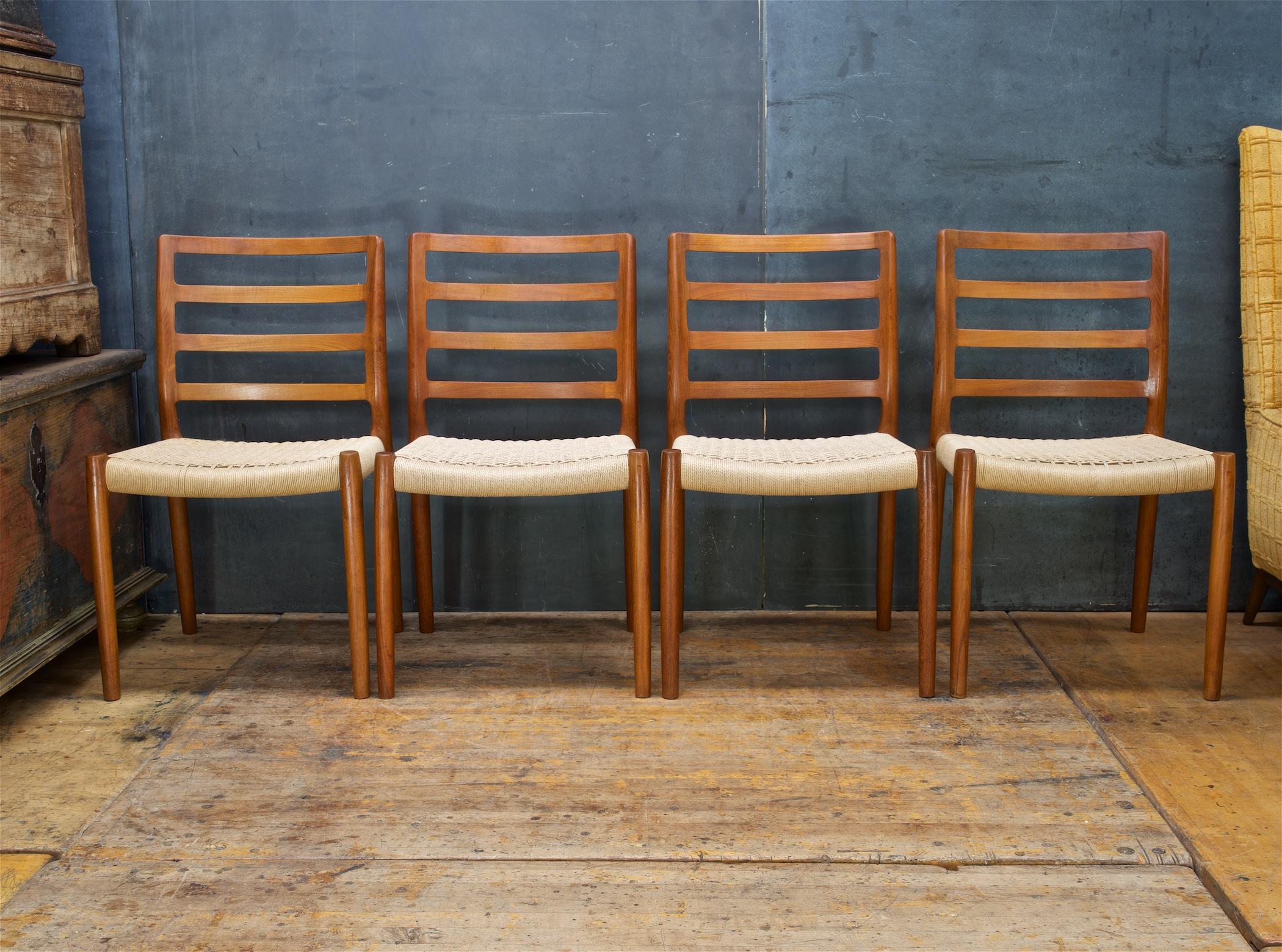 1981 Teak + Wickered Paper Cord Model Nº 85 side chairs by Niels Moller for J.L. Møllers Møbelfabrik, Denmark. A wonder and heavy solid old growth deep hued teak wood chair design. Four side chairs. All chair frames are tight and strong. Measure: