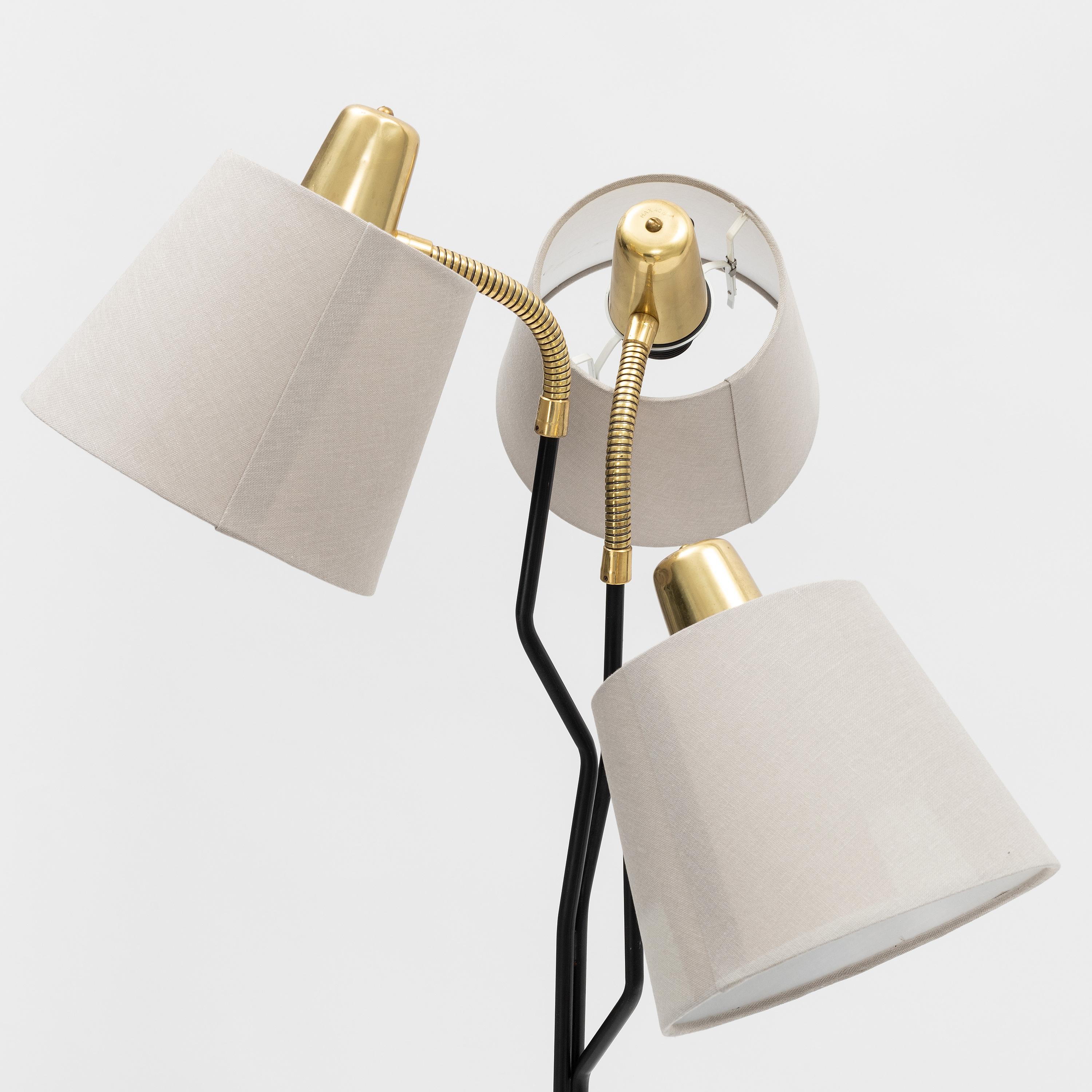 Cast iron base, 3 arms with goose neck fitted with E27 bakelite sockets and fabrics lamp shades. Designed in Sweden in the 1960s.