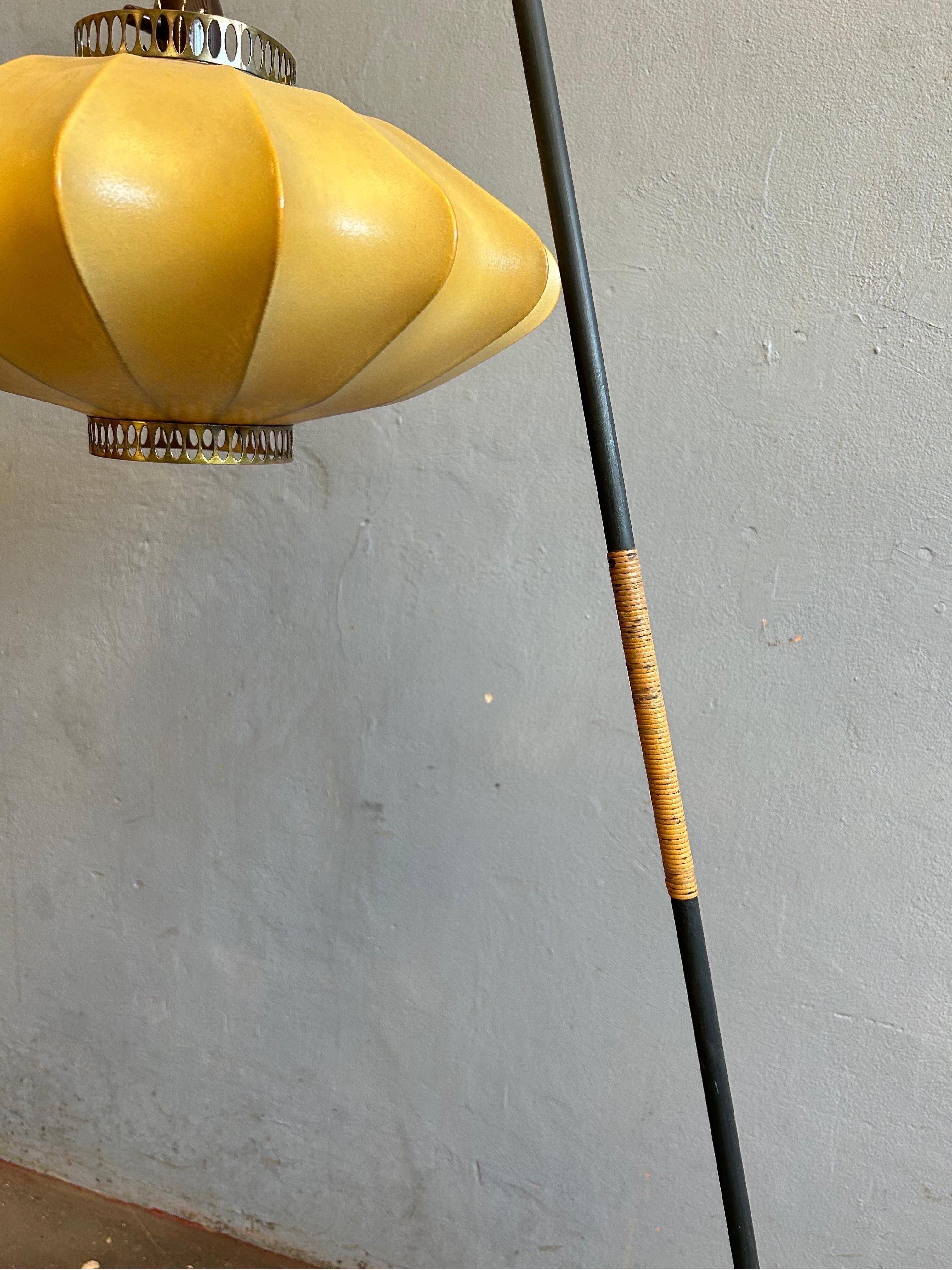 Rare Scandinavian floor lamp in black steel with a rattan handle detail and a beautiful cocoon lamp shade with brass details.

This lamp is the perfect piece for any interior and can fit anything from a Scandinavian interior or a more modern