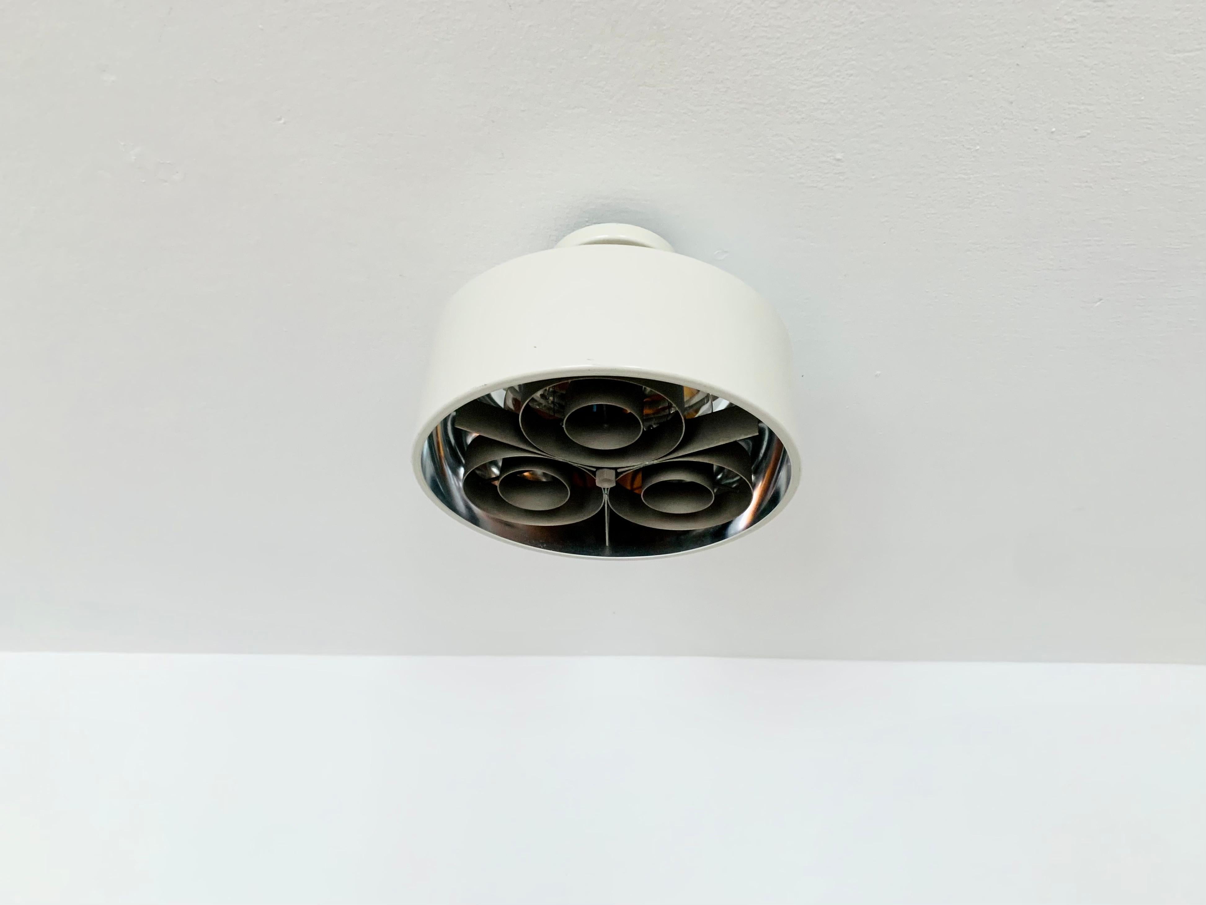 Swedish ceiling lamp from the 1960s.
Exceptional design and very high-quality workmanship.
The lamp is a highlight for every room.
The reflector creates a spectacular play of light

Condition:

Very good vintage condition with slight signs of wear