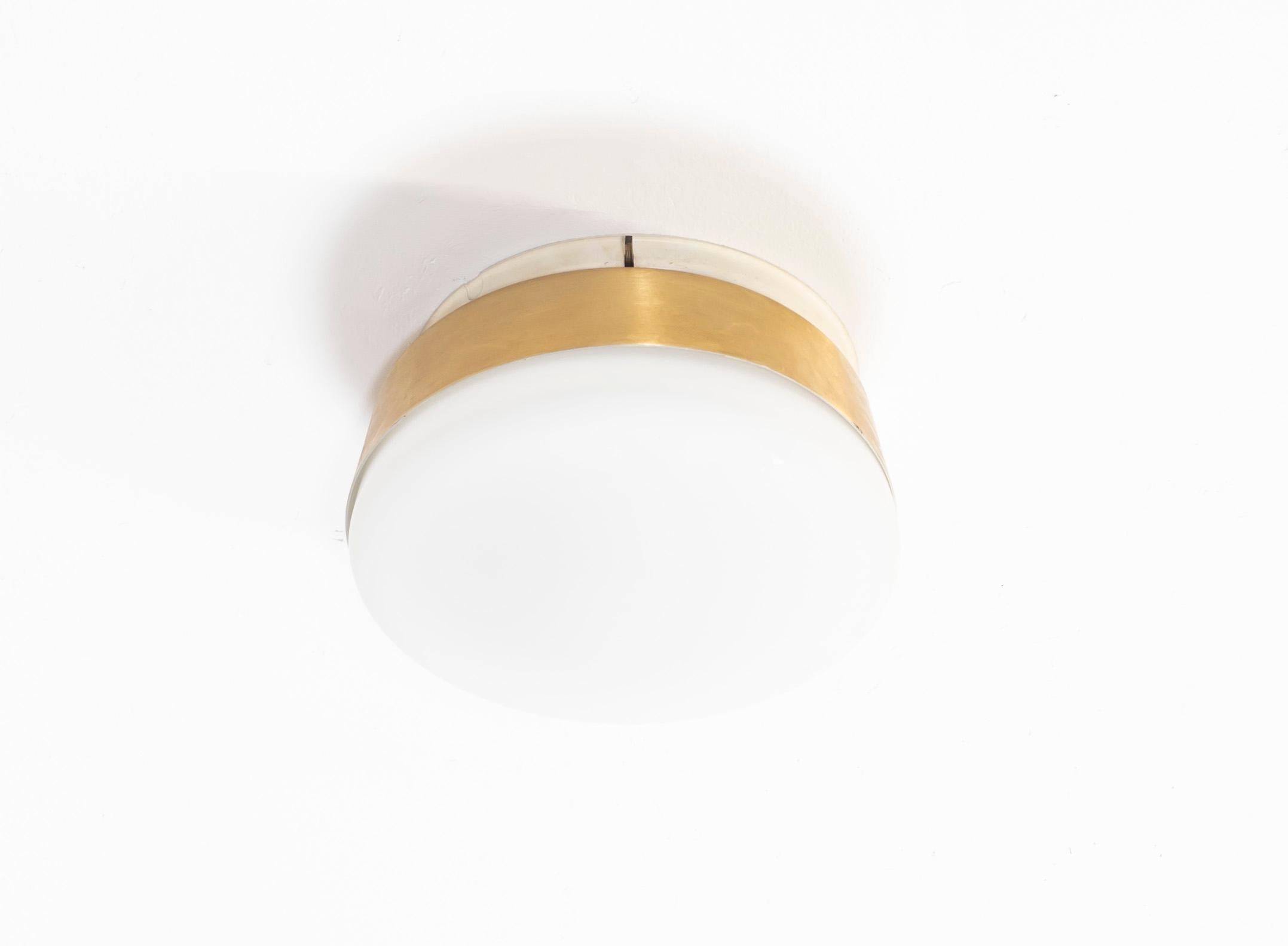 Wonderful and sublime ceiling lamp with a shade in opaline glass and frame in brass. Designed and made in Norway, from circa 1950s first half by Sønnico. The lamp is fully working and in good vintage condition. It is fitted with one E27 bulb holder