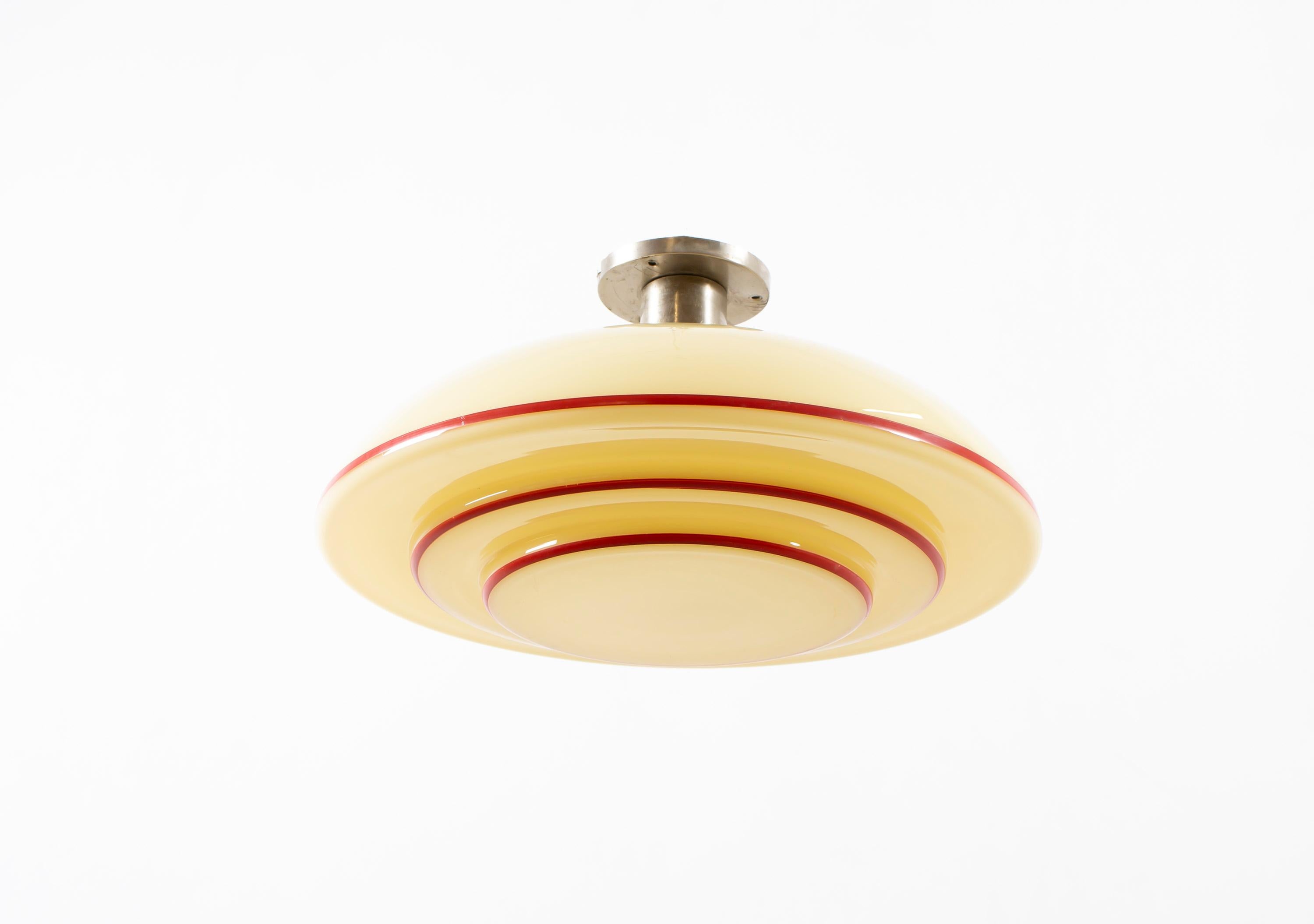 Wonderful ceiling light with decorated glass shade. Designed and made in Norway from ca 1950s first half. The lamp is fully working and in very good vintage condition. It is fitted with one E27 bulb holder (works in the US) and carries a max wattage