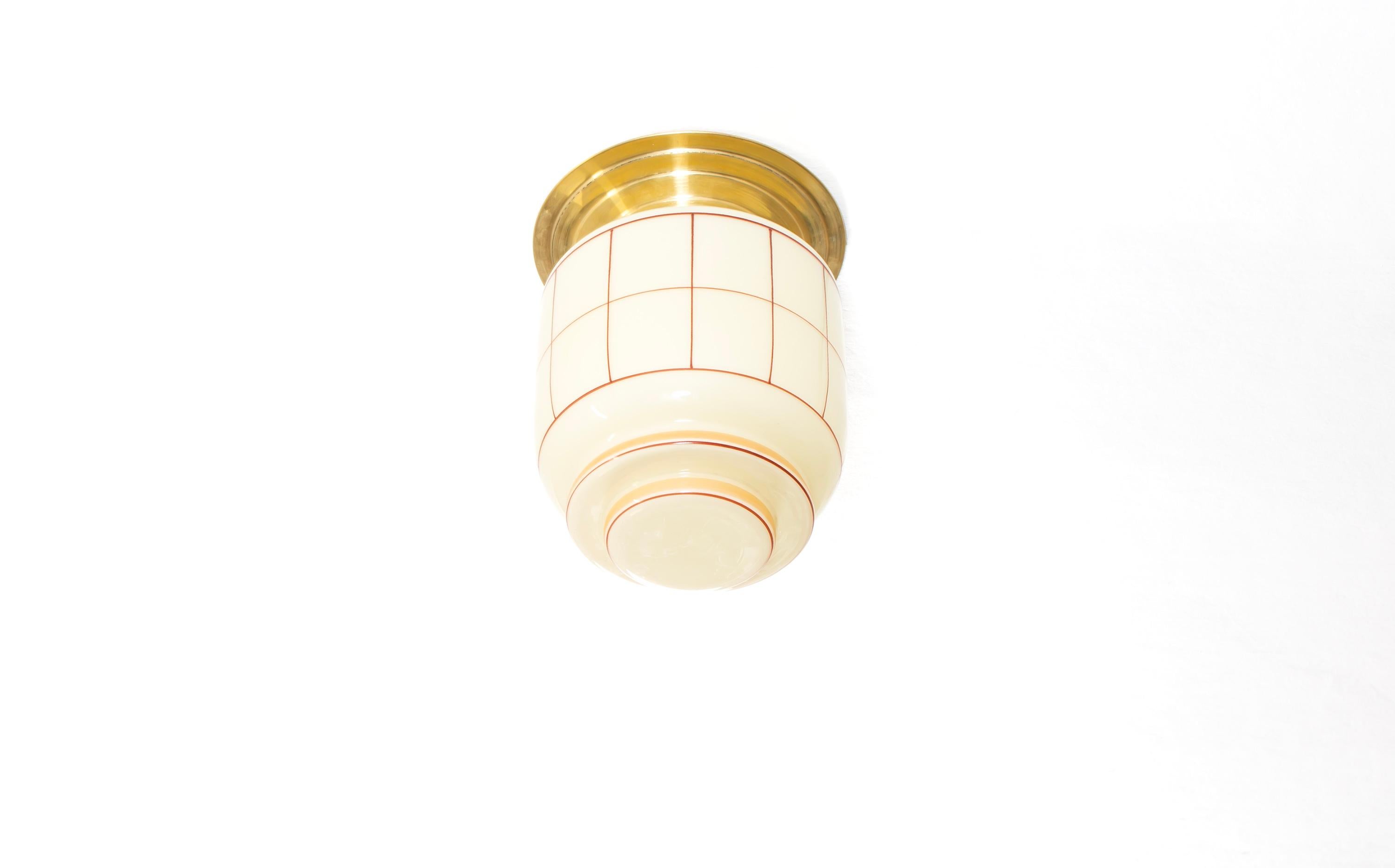 Wonderful ceiling light with hand-decorated glass shade and brass metal base. Designed and made in Norway from circa 1950s first half. Perfectly scaled for entryways, hallways, or restrooms, this ceiling light offers a warm, diffused glow and an