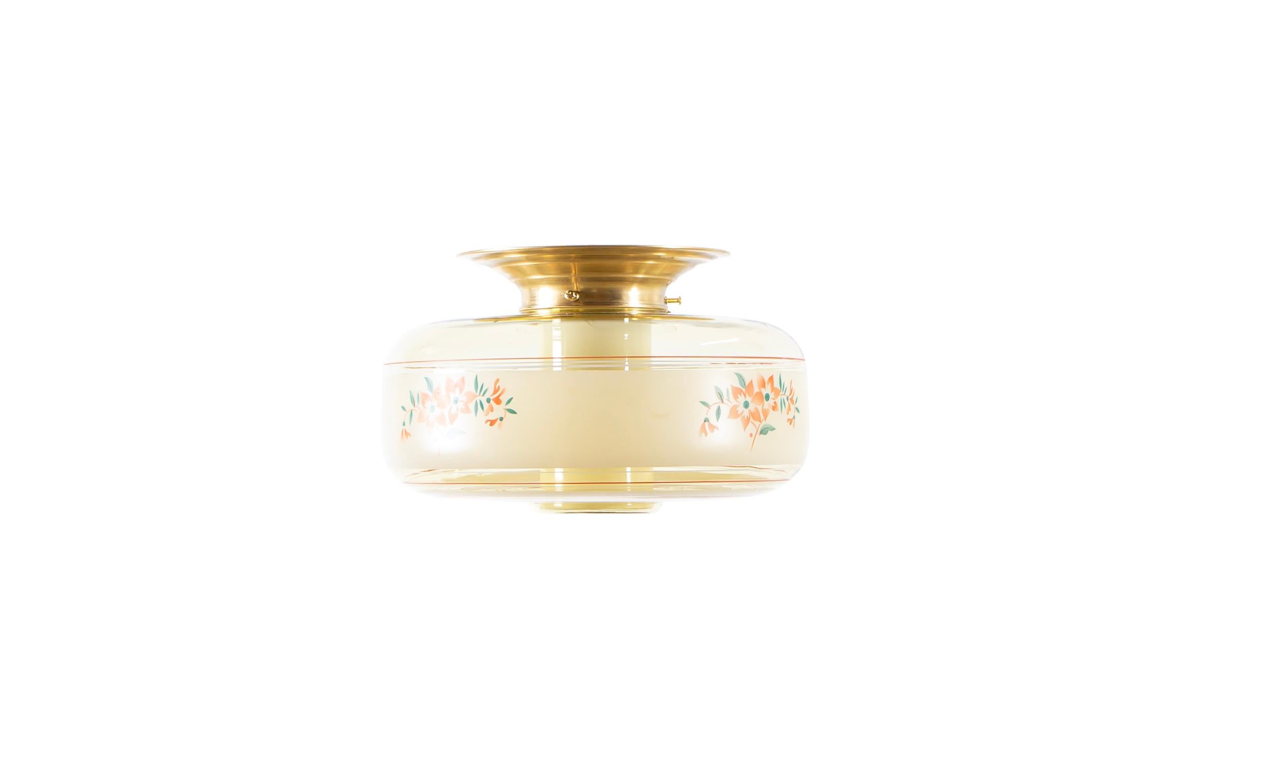 Wonderful ceiling light with hand-decorated glass shade, with an additional inner shade in opaline glass and brass metal base. Designed and made in Norway from ca 1950s first half. The lamp is fully working and in good vintage condition. It is