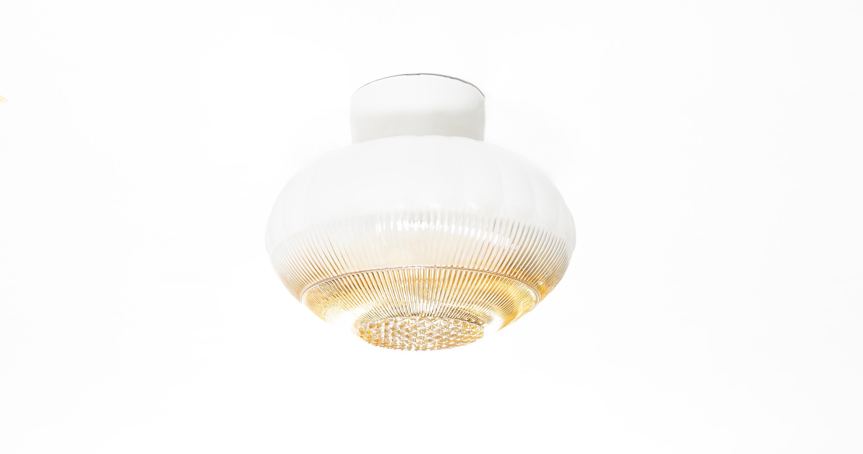 Wonderful and decorative ceiling light with shade in hand-painted glass and base in porcelain. Designed and made in Norway from circa 1950s first half. The lamp is fully working and in very good vintage condition. The lamp uses a E27 bulb (works in