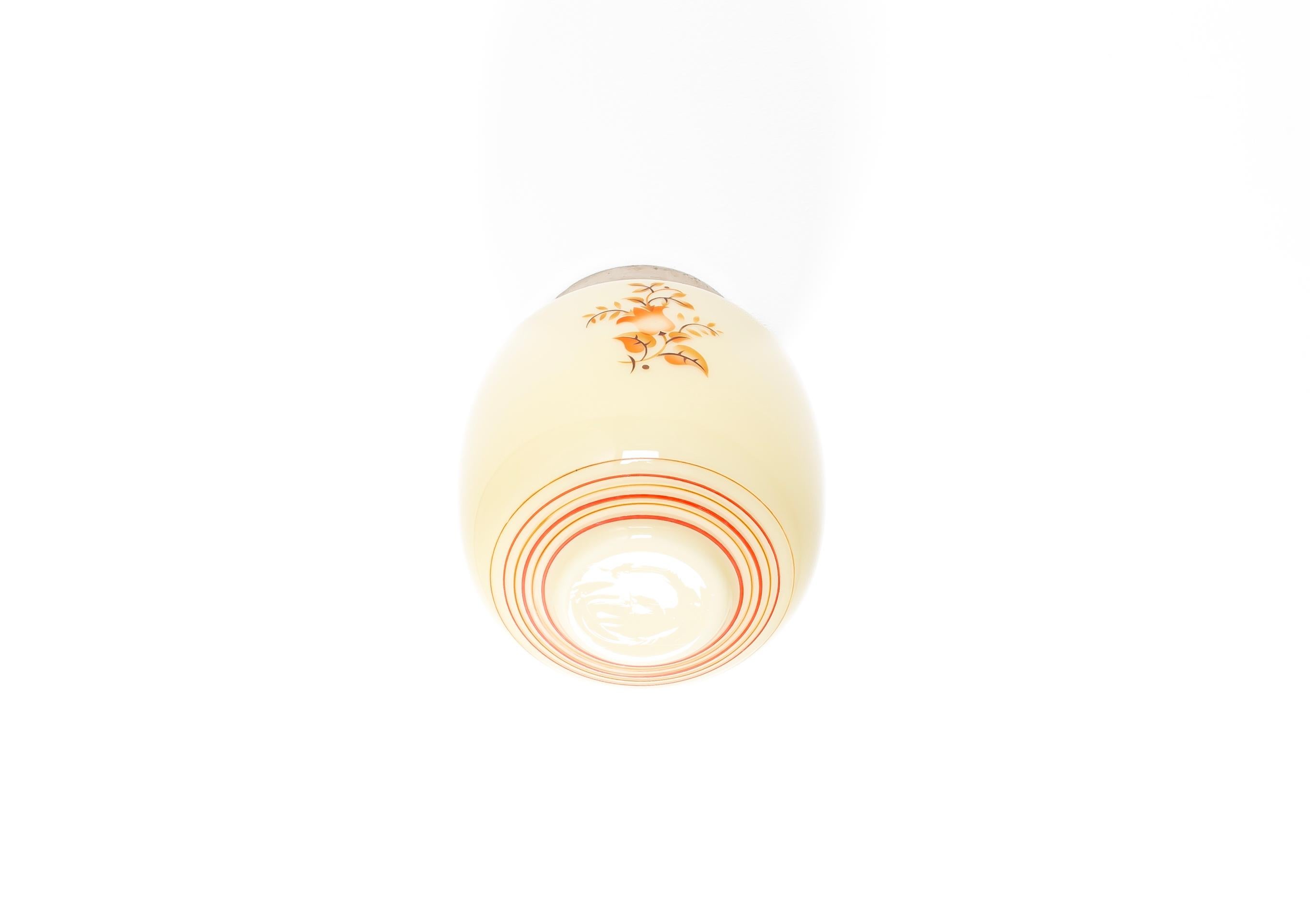 Wonderful ceiling light with hand-decorated shade in opaline glass and chrome metal base. Designed and made in Norway from ca 1950s first half. The lamp is fully working and in good vintage condition. It is fitted with one E27 bulb holder (works in