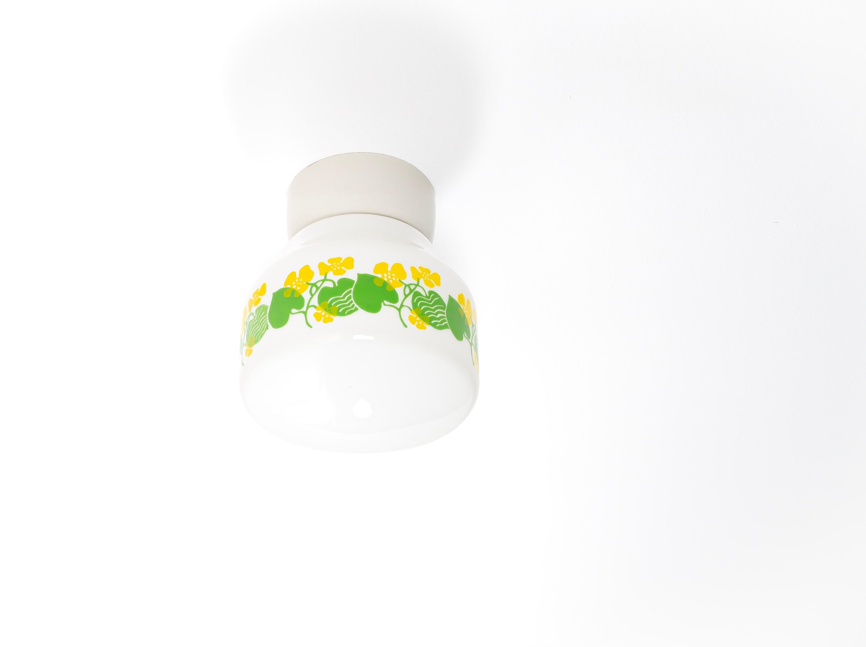 Wonderful and decorative ceiling light with shade in hand-painted glass and base in porcelain. Designed and made in Norway from circa 1950s first half. The lamp is fully working and in very good vintage condition. The lamp uses a E27 bulb (works in