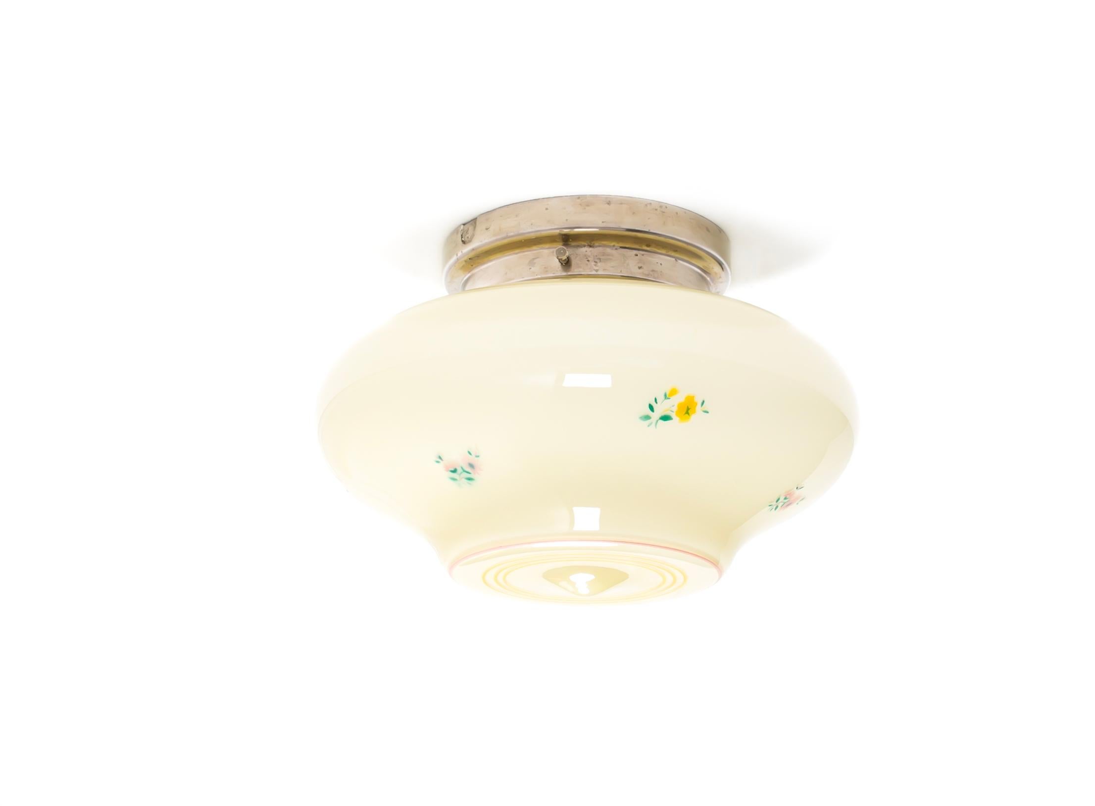 Wonderful ceiling light with hand-decorated shade in opaline glass and chrome metal base. Designed and made in Norway from ca 1950s first half. The lamp is fully working and in good vintage condition. It is fitted with one E27 bulb holder (works in