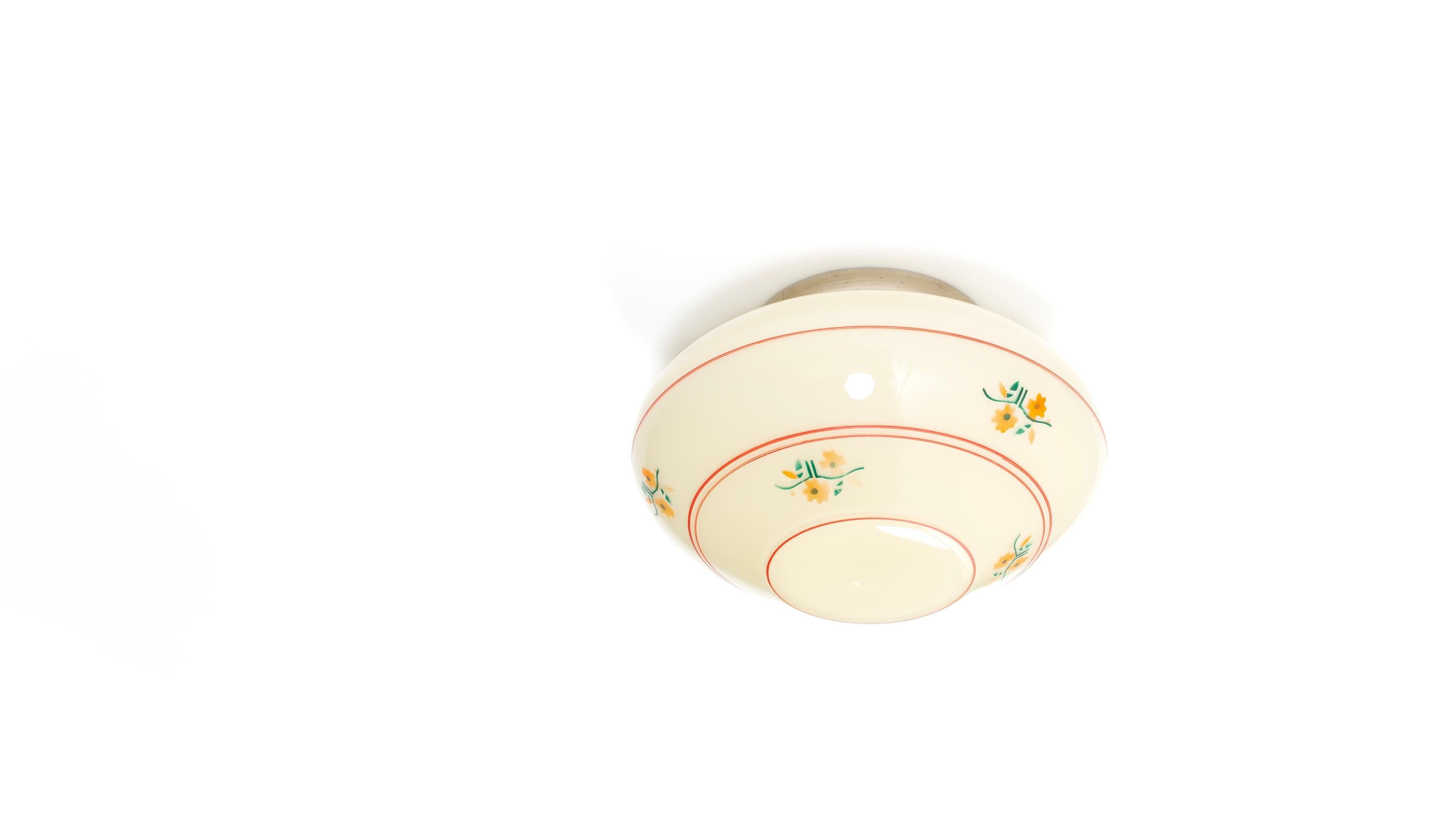 Wonderful ceiling light with hand-decorated shade in opaline glass and chrome metal base. Designed and made in Norway from ca 1950s first half. The lamp is fully working and in good vintage condition. It is fitted with one E27 bulb holder (works in