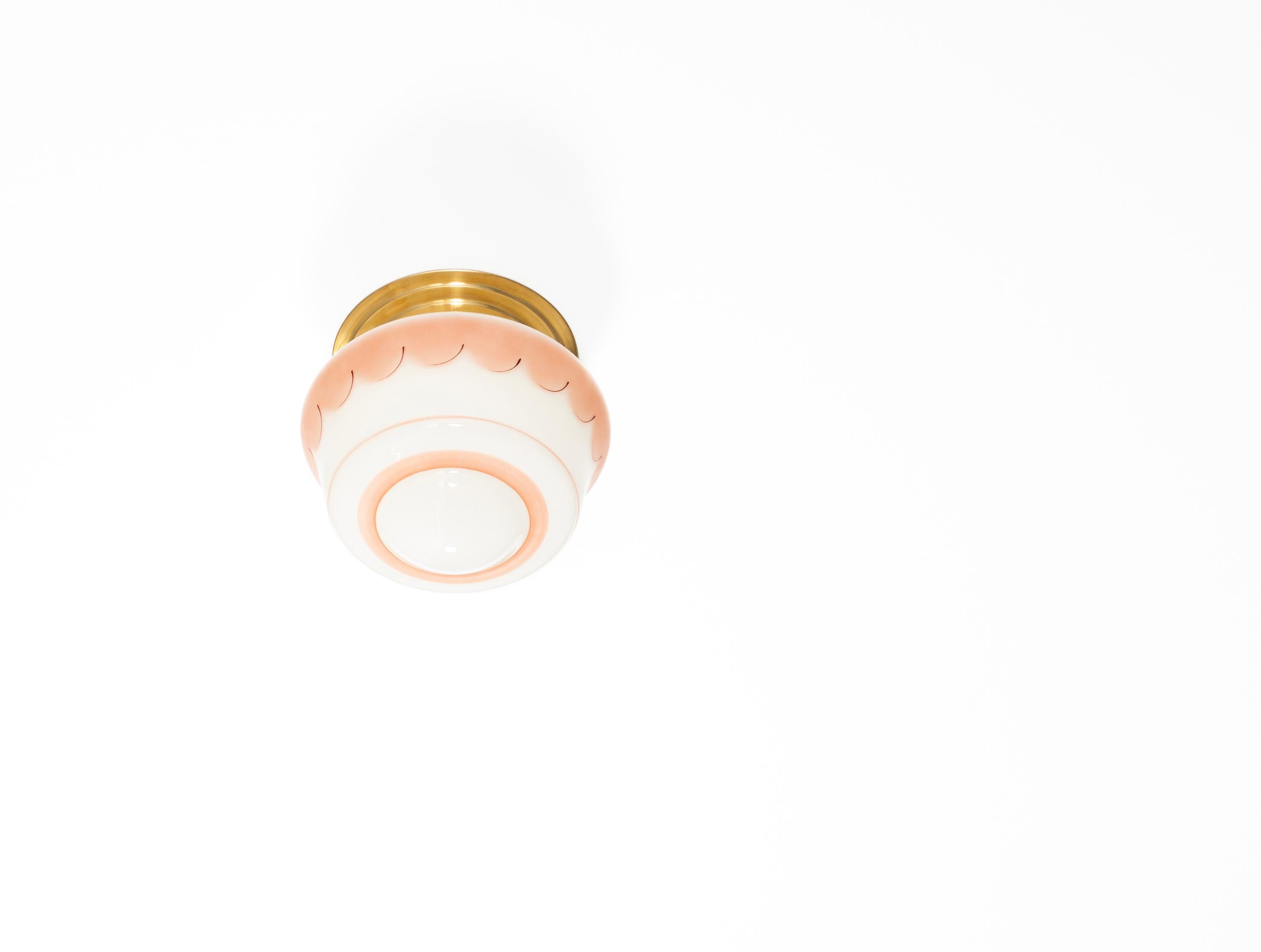 Wonderful ceiling light with hand-painted glass shade and brass metal base. Designed and made in Norway from circa 1950s first half. The lamp is fully working and in good vintage condition. It is fitted with one E27 bulb holder (works in the US) and