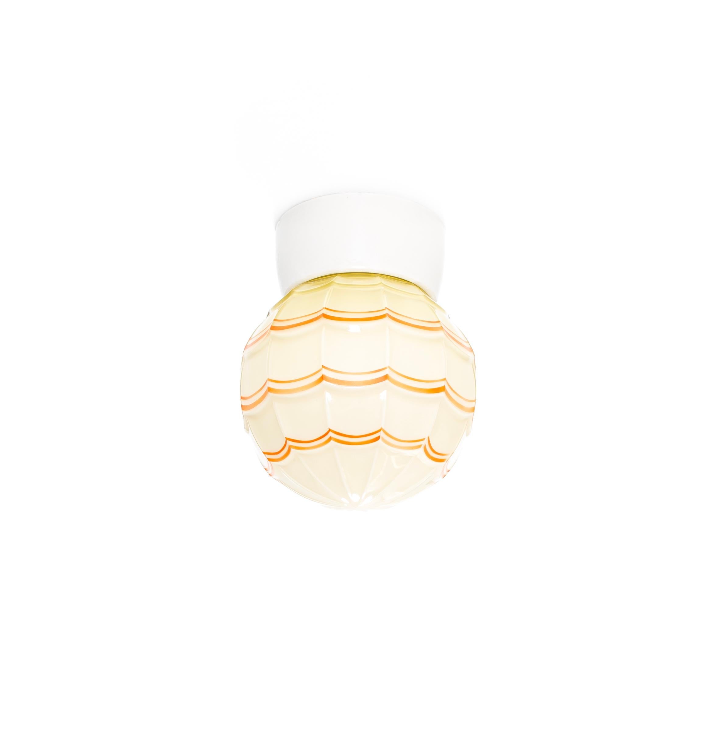 Wonderful ceiling light with decorated glass shade and base in porcelain. Designed and made in Norway from circa 1950s first half. The lamp is fully working and in very good vintage condition. The lamp uses a E27 bulb (works in the US), with a max