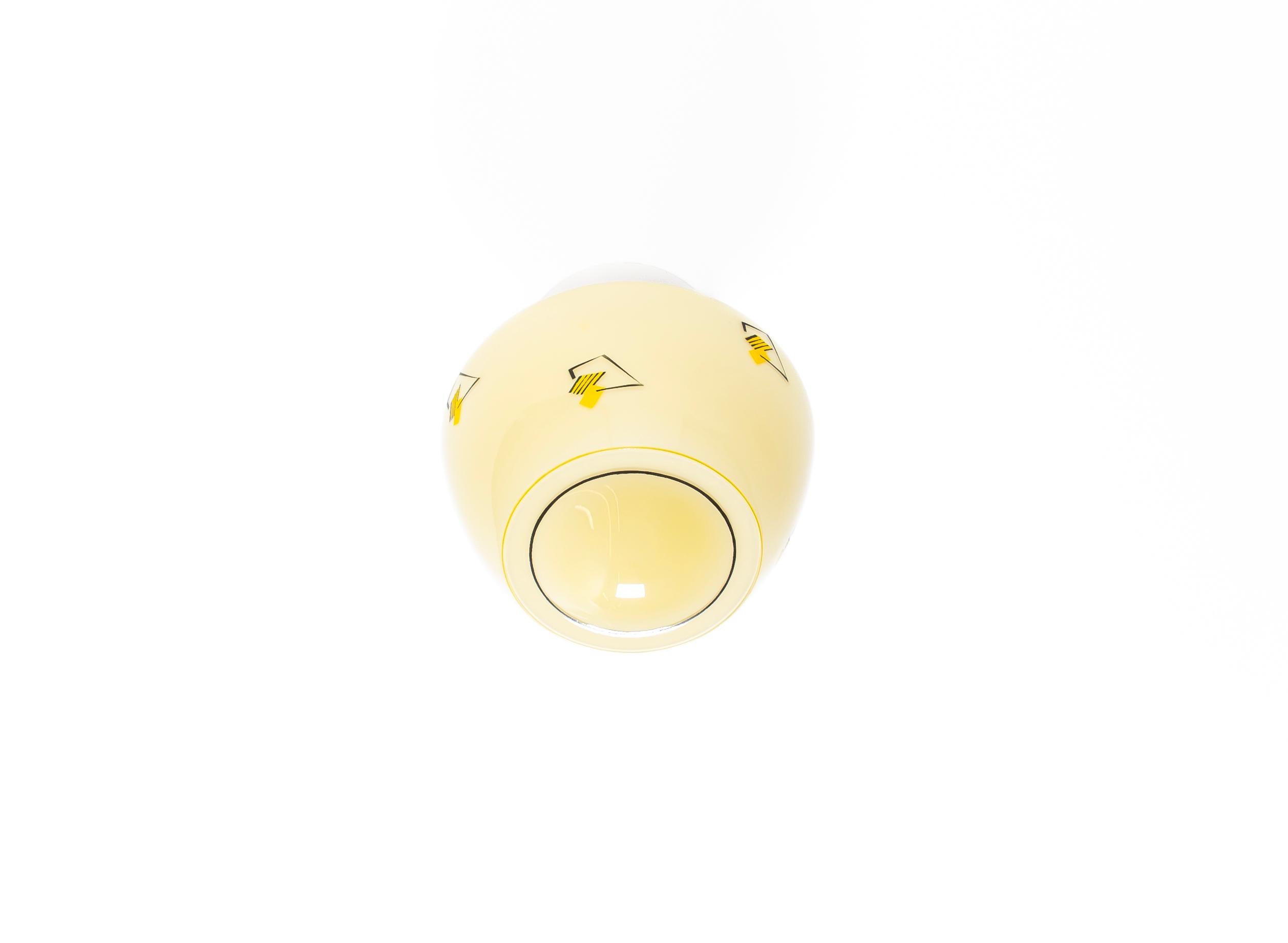Wonderful ceiling light with decorated glass shade and base in porcelain. Designed and made in Norway from circa 1950s first half. The lamp is fully working and in very good vintage condition. The lamp uses a E27 bulb (works in the US), with a