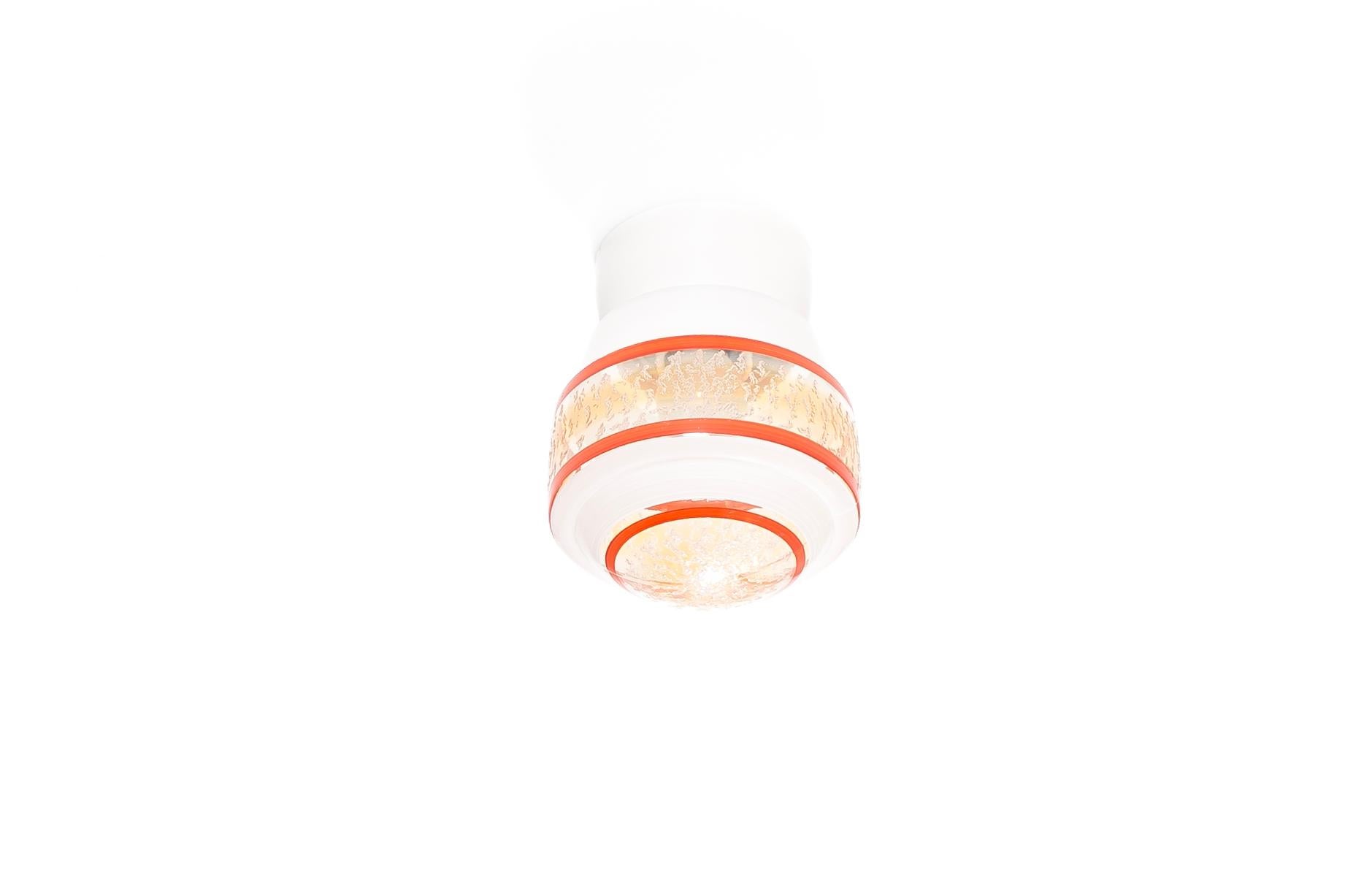 Wonderful ceiling light with decorated glass shade and base in porcelain. Designed and made in Norway from circa 1950s first half. The lamp is fully working and in very good vintage condition. The lamp uses a E27 bulb (works in the US), with a max