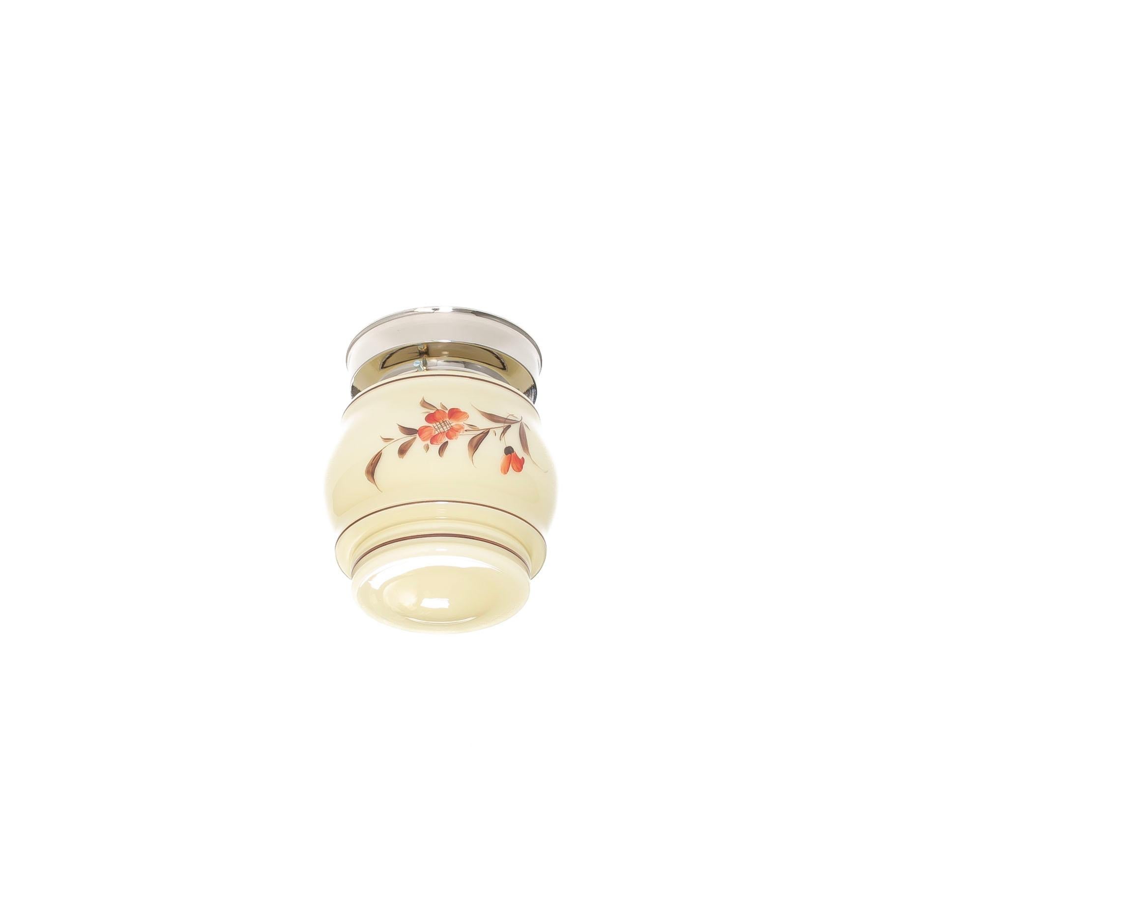Flush mount ceiling light with decorated glass shade and chrome metal base. Designed and made in Norway from ca 1960s first half. The lamp is fully working and in good vintage condition. It is fitted with one E27 bulb holder (works in the US) and