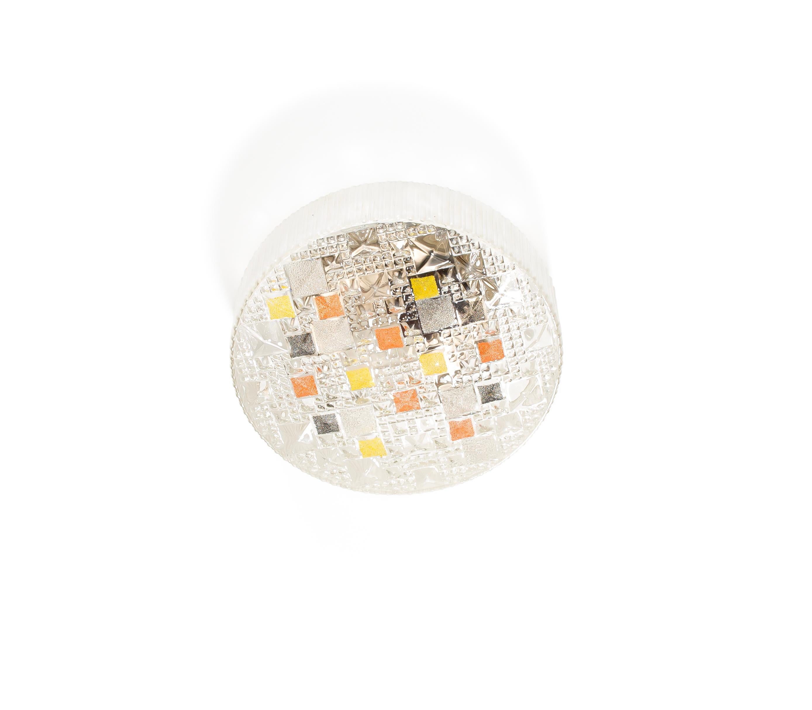 Wonderful ceiling light with a decorated glass shade and metal base. Designed and made in Norway from ca 1960s second half. The lamp is fully working and in good vintage condition. It is fitted with one E27 bulb holder (works in the US) and carries